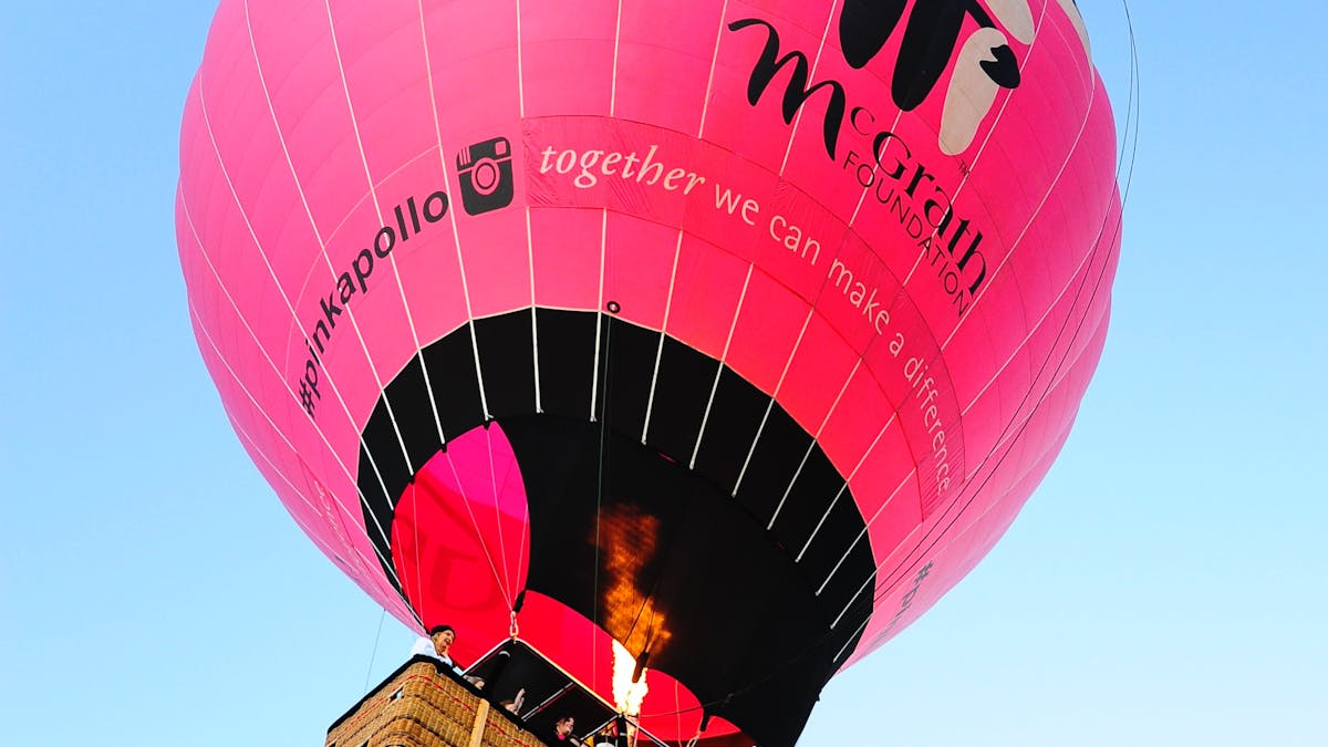 Giant Pink Hot Air Balloon rising up into the Air