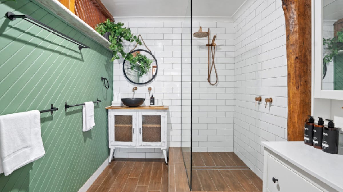 Shared bathroom with shower and separate toilet