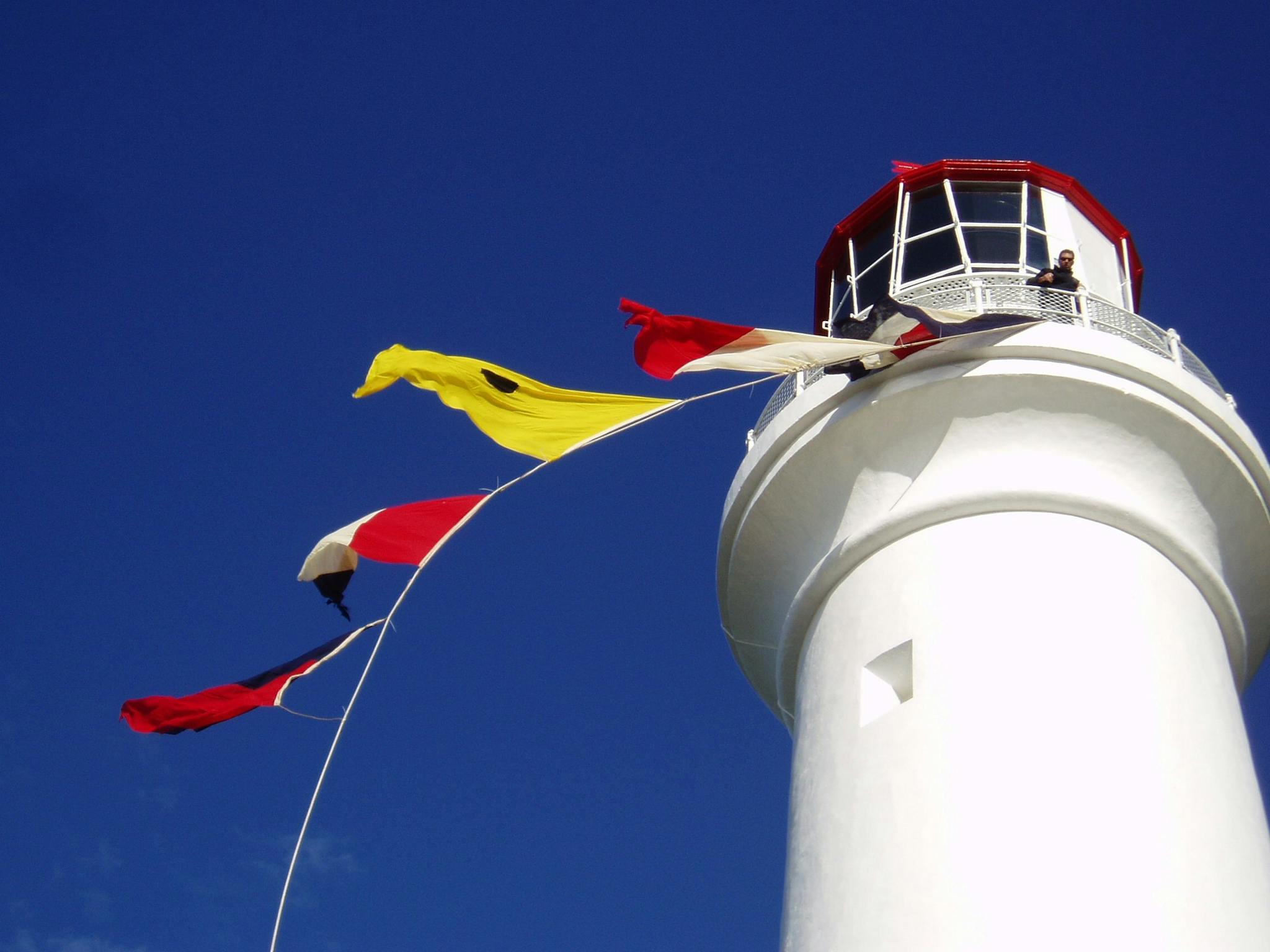 A view up to the balcony of Split Point Lighthouse. Signal Flags displayed