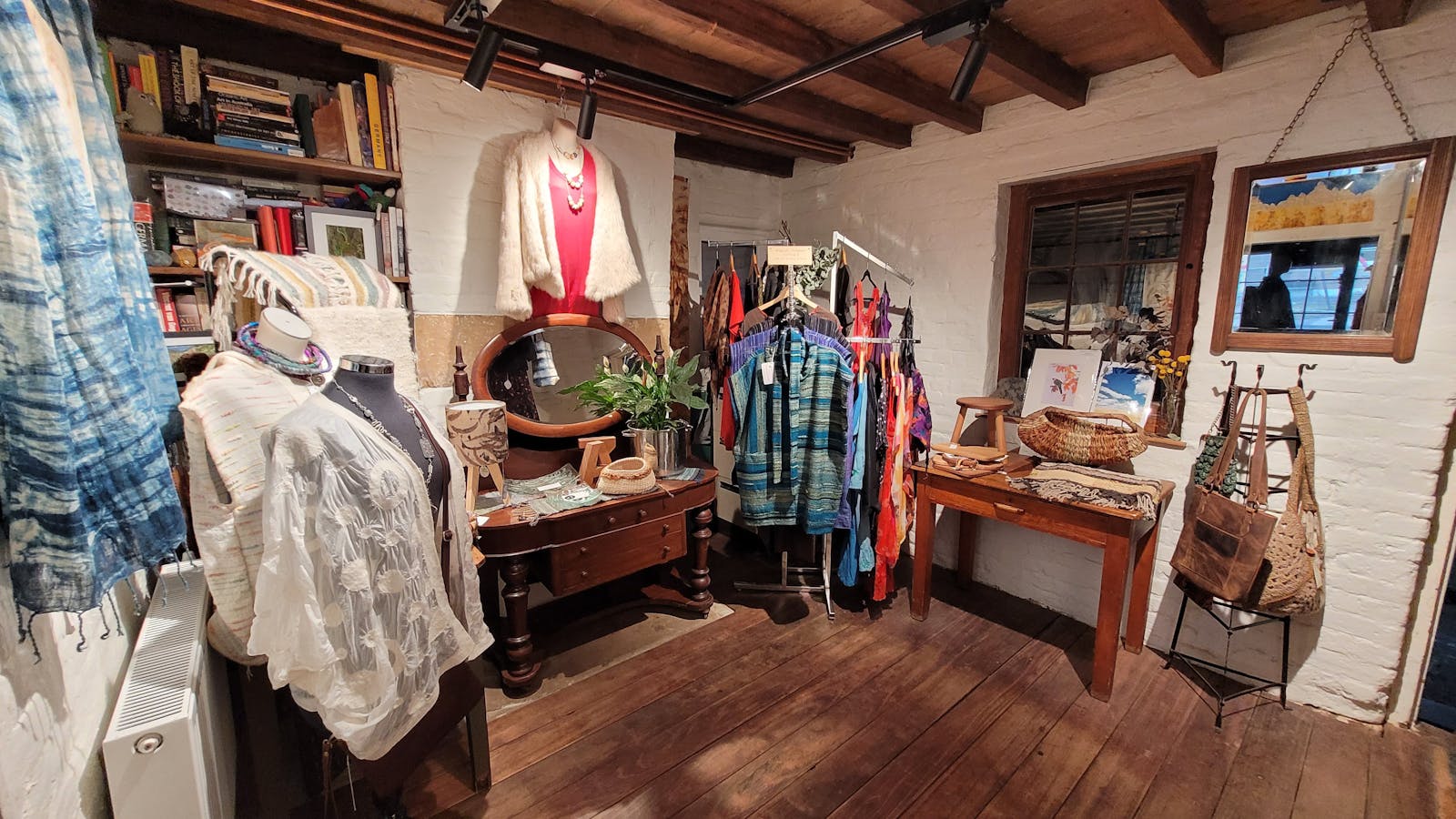 Snug, studio three displays wearable art, timber and ceramics.