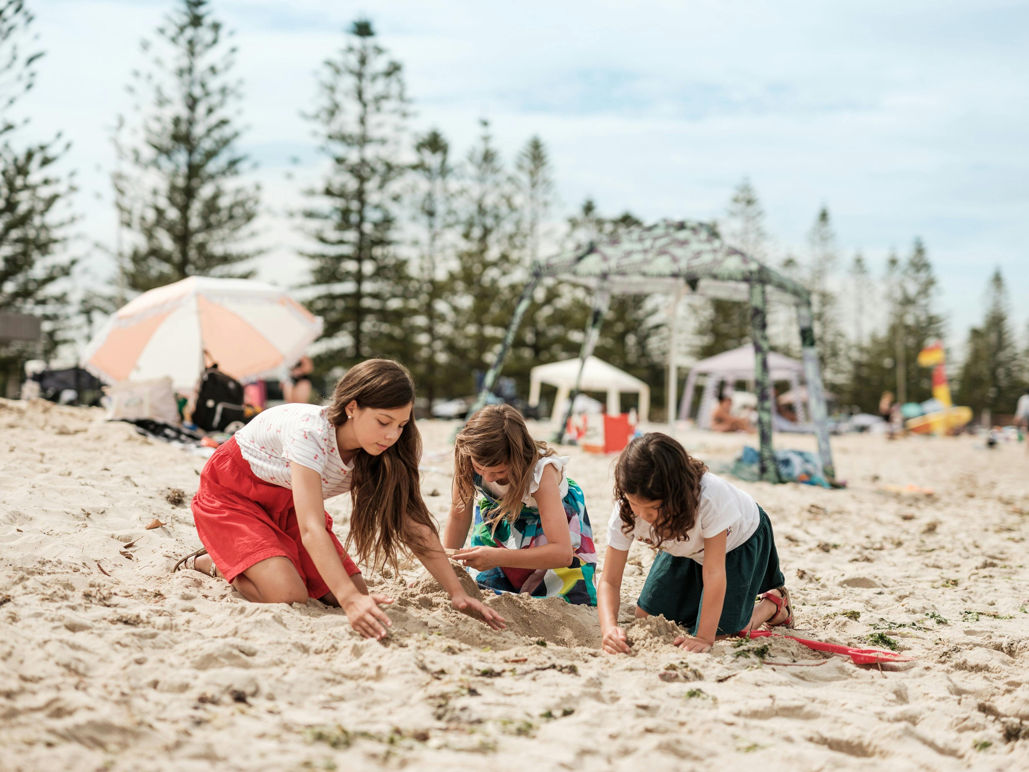 Kids building sand castle at Altona Beach