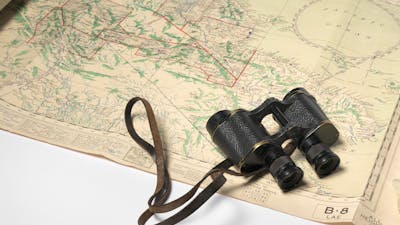 Binoculars and map