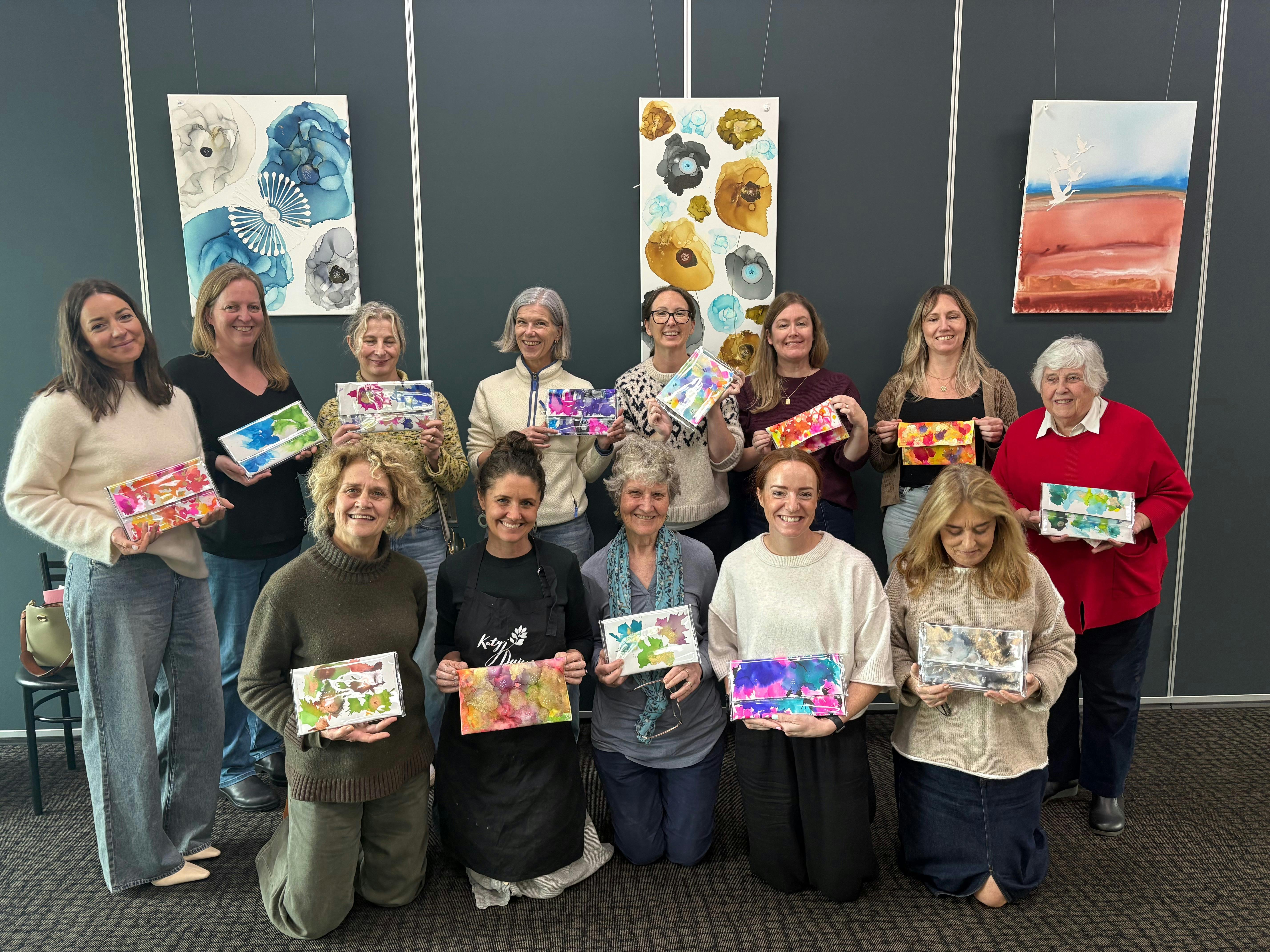 A recent workshop where we painted clutch bags