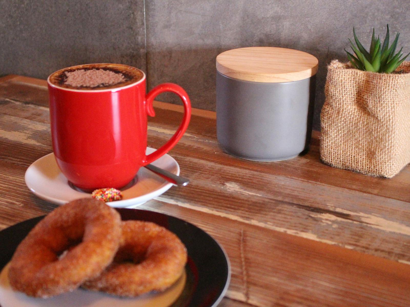 Hot fresh donuts with a cappuccino  - the perfect mix!