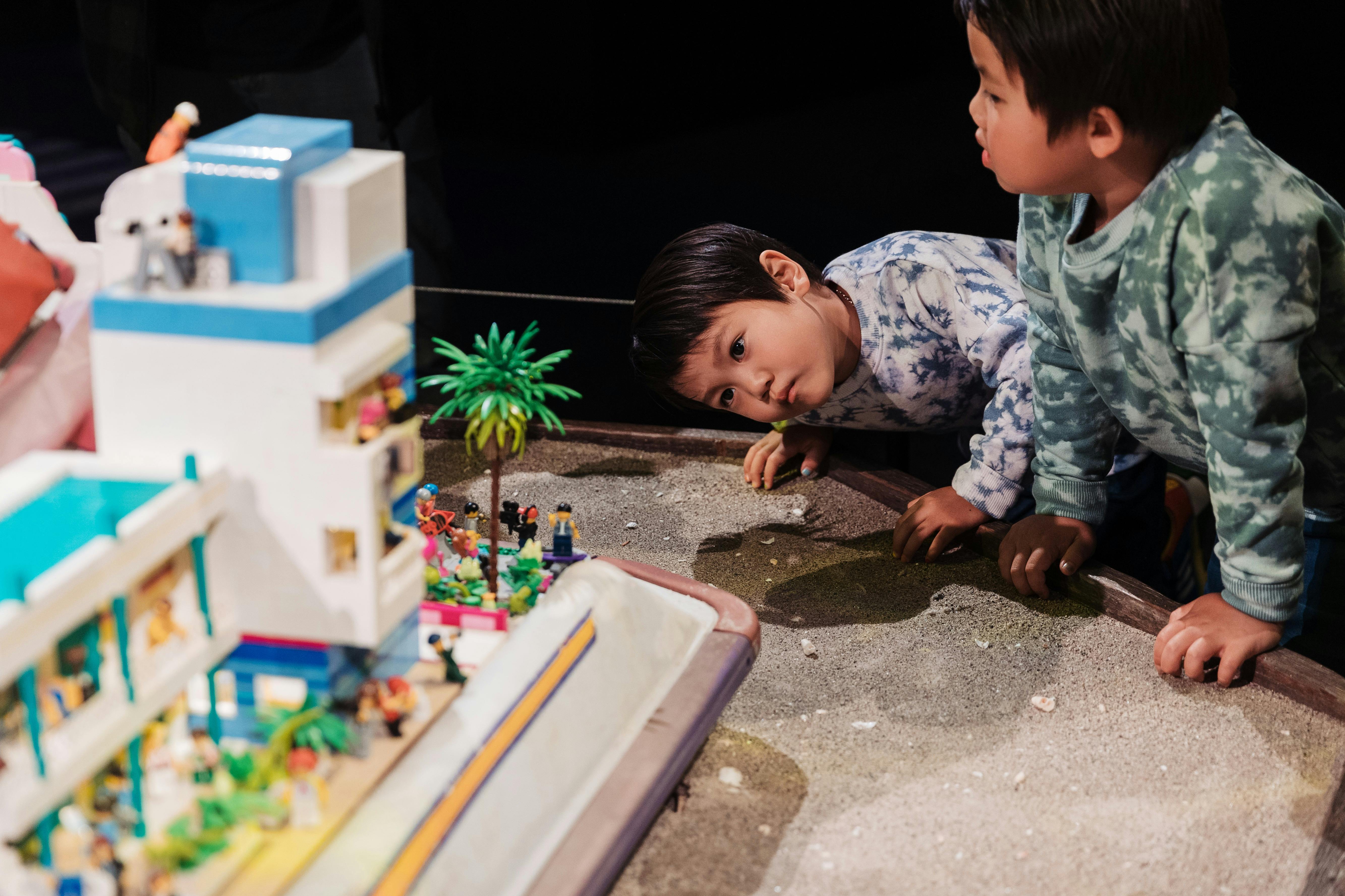 A small boy stares intently at jetski exhibit in RELICS
