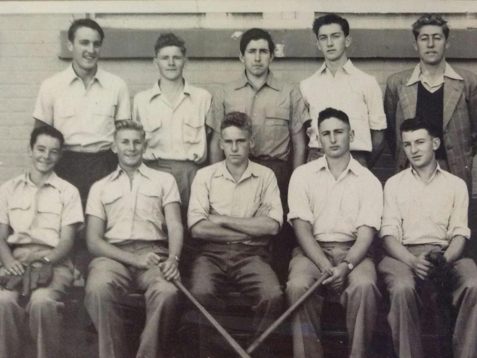 A sepia group photograph of Frank Moorhouse in the middle front and members of softball team.