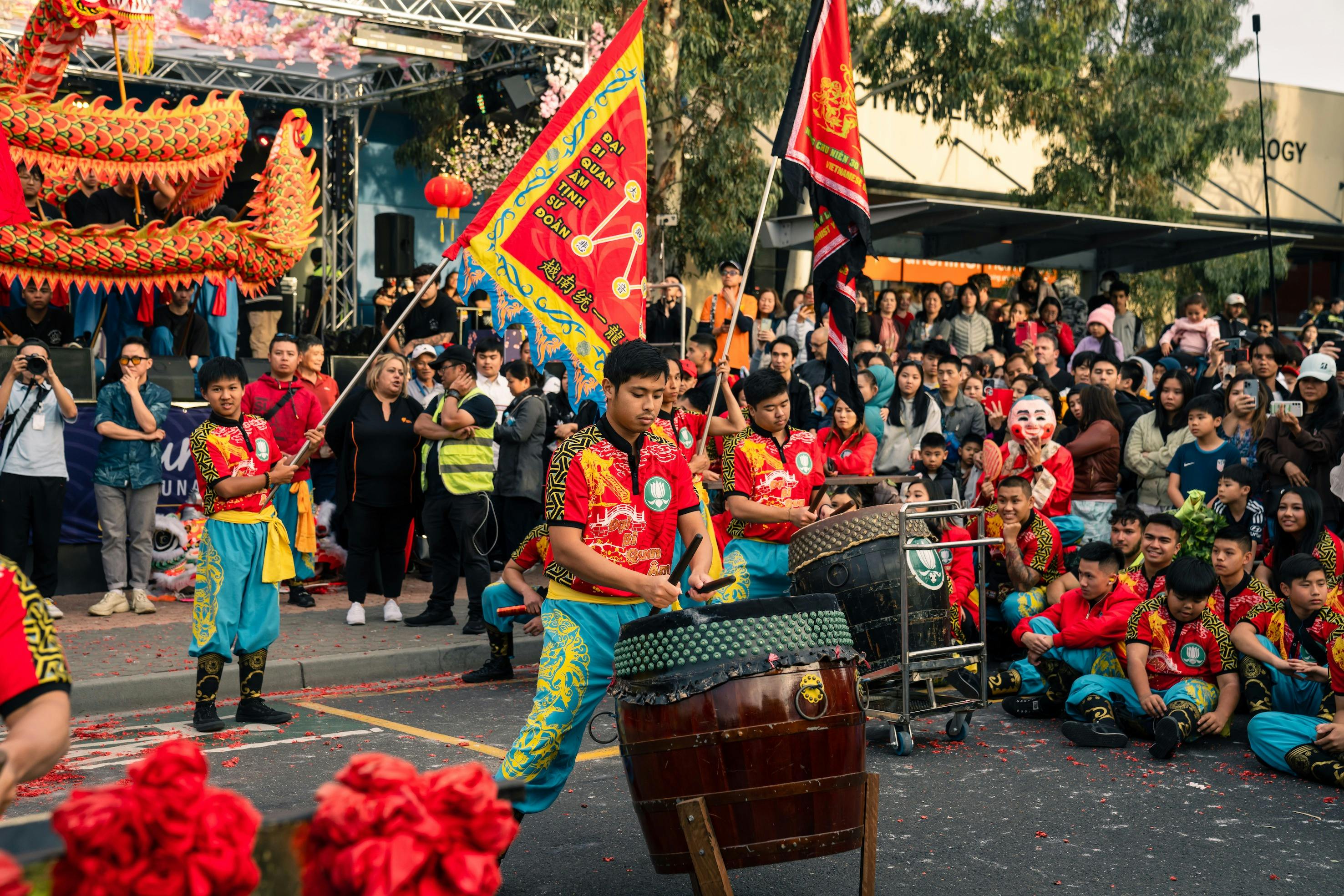 Cultural Vietnamese Drumming & flags on street