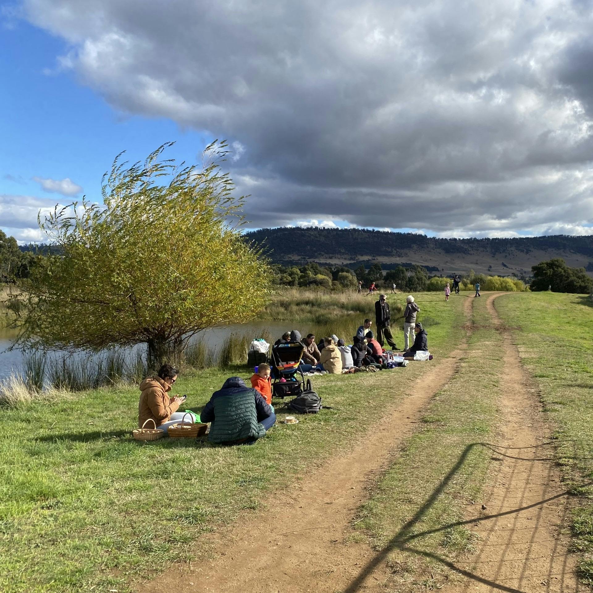 Families picnic by the dam
