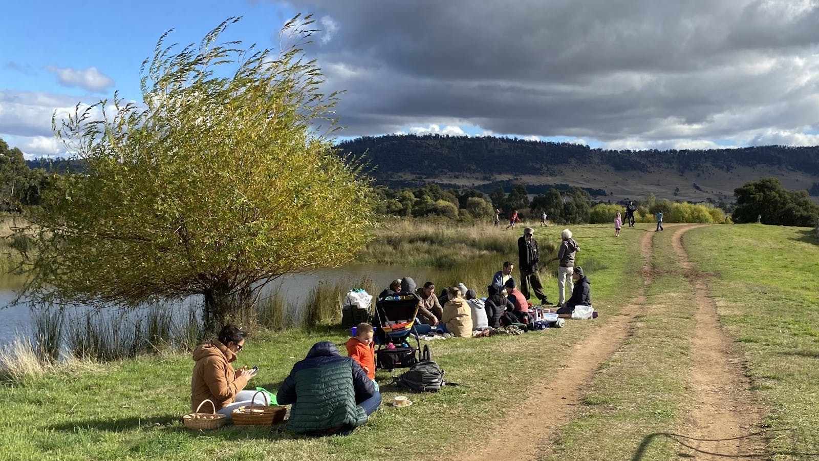 Families picnic by the dam