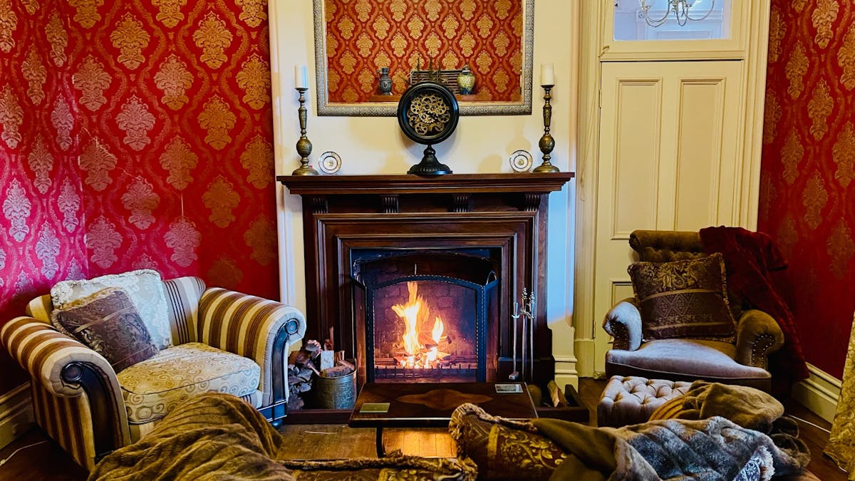 The Scarlet lounge with original fireplace is a popular lounge during Winter.