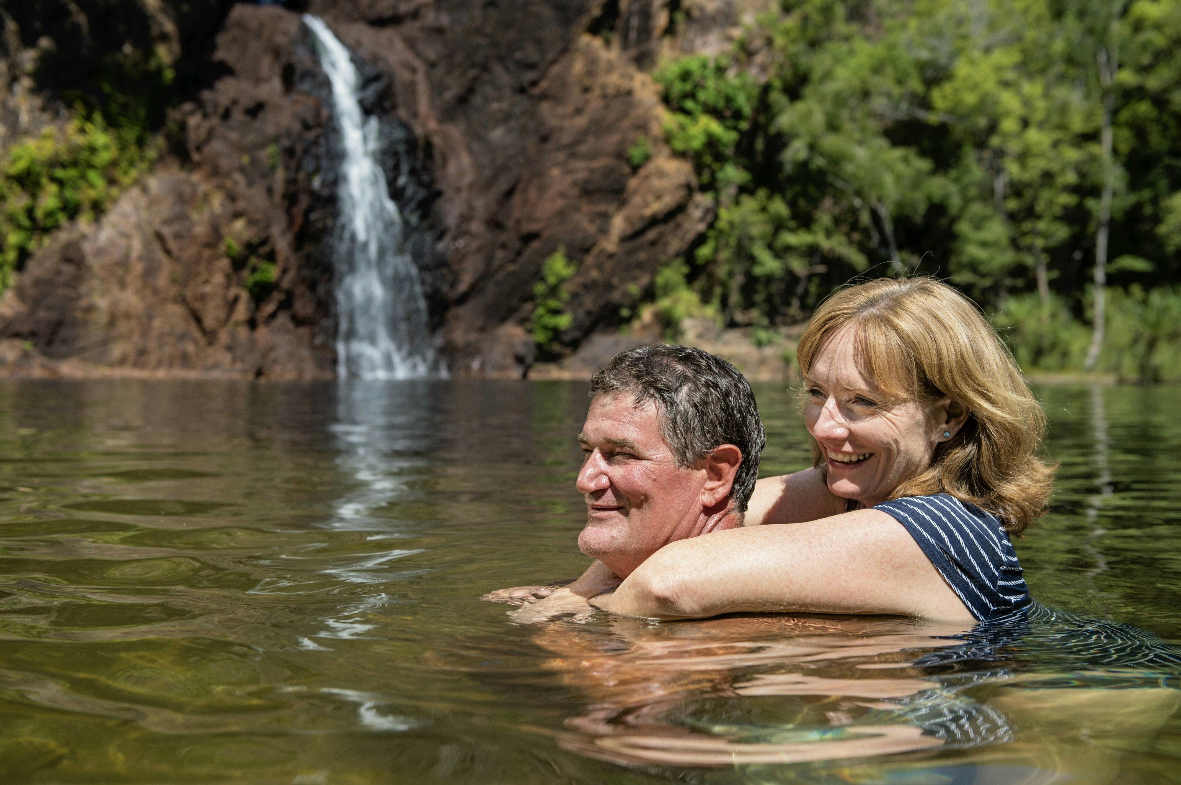 Visitors swimming in the waterhole at Wangi Falls.