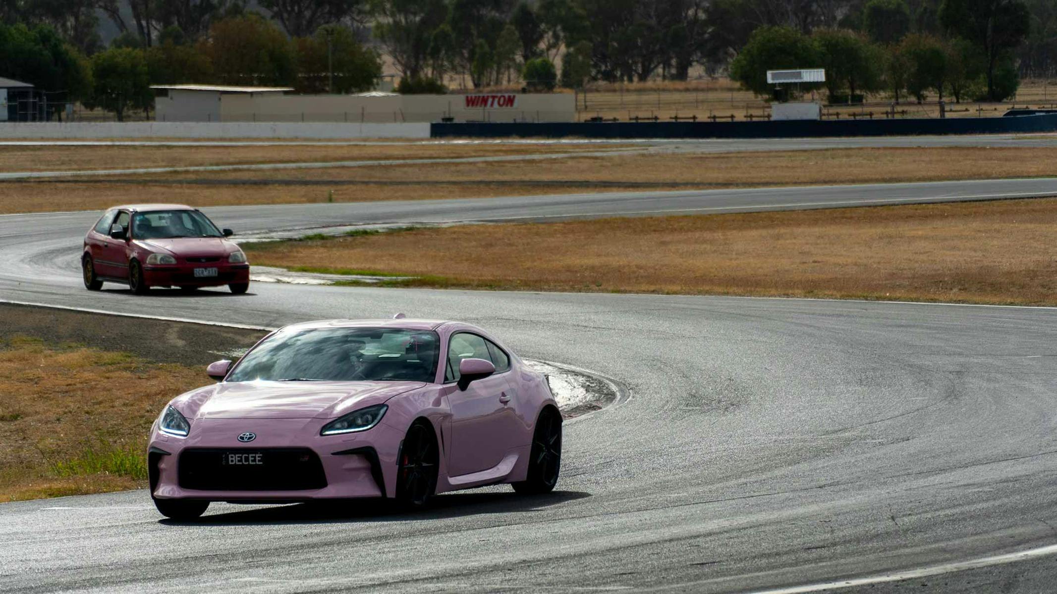 2 cars on a racetrack