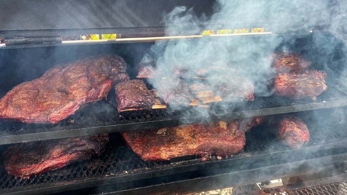 Big chunks of brisket is smoked over AUstralian hardwood in an upright smoker for 24 hours