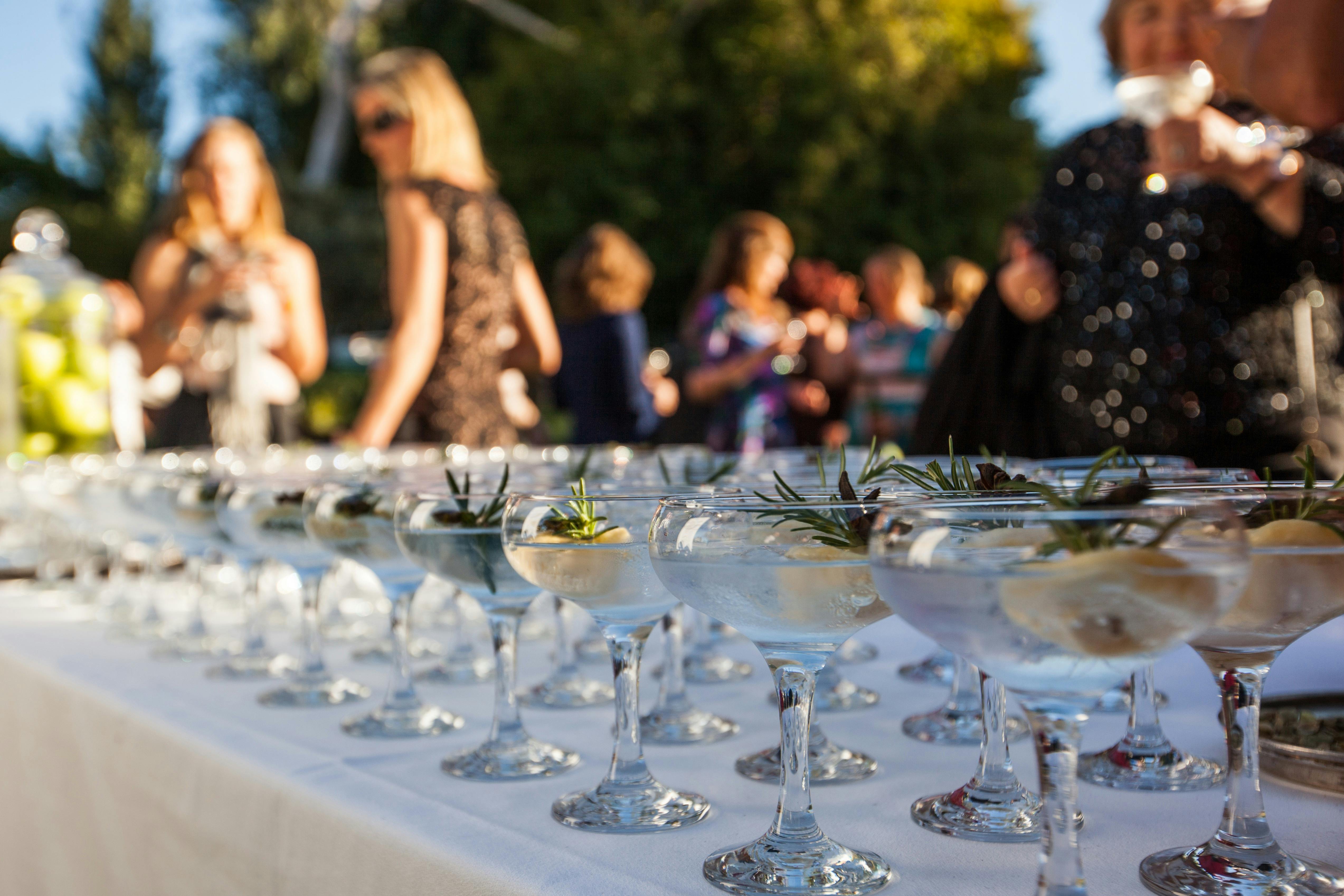 Gin cocktails with people enjoying drinks in background