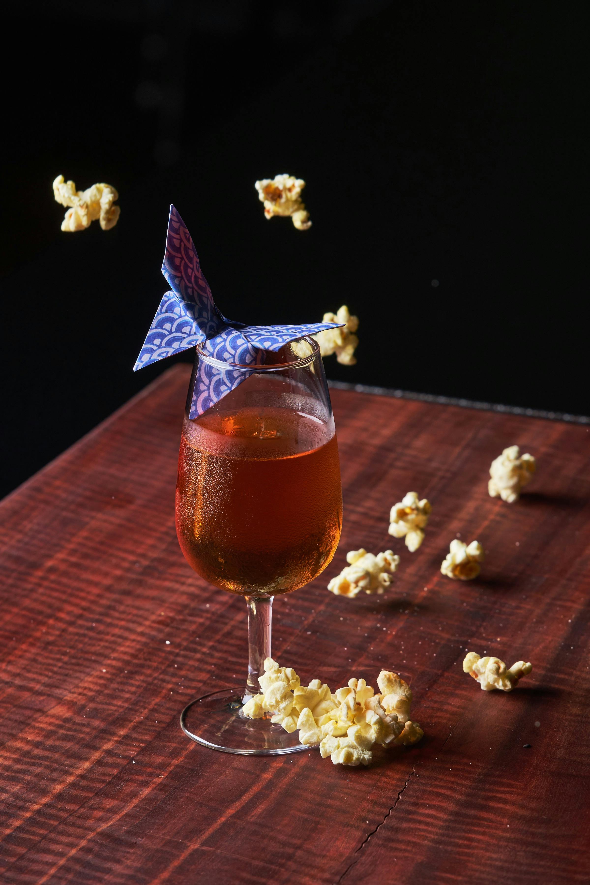 A short cocktail from our current menu, complete with origami moth.