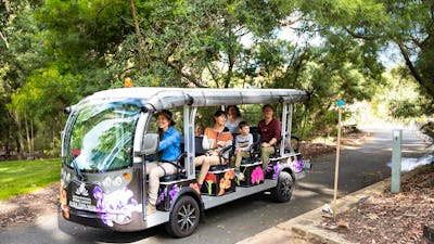 Adults and children on board the Flora Explorer electric bus