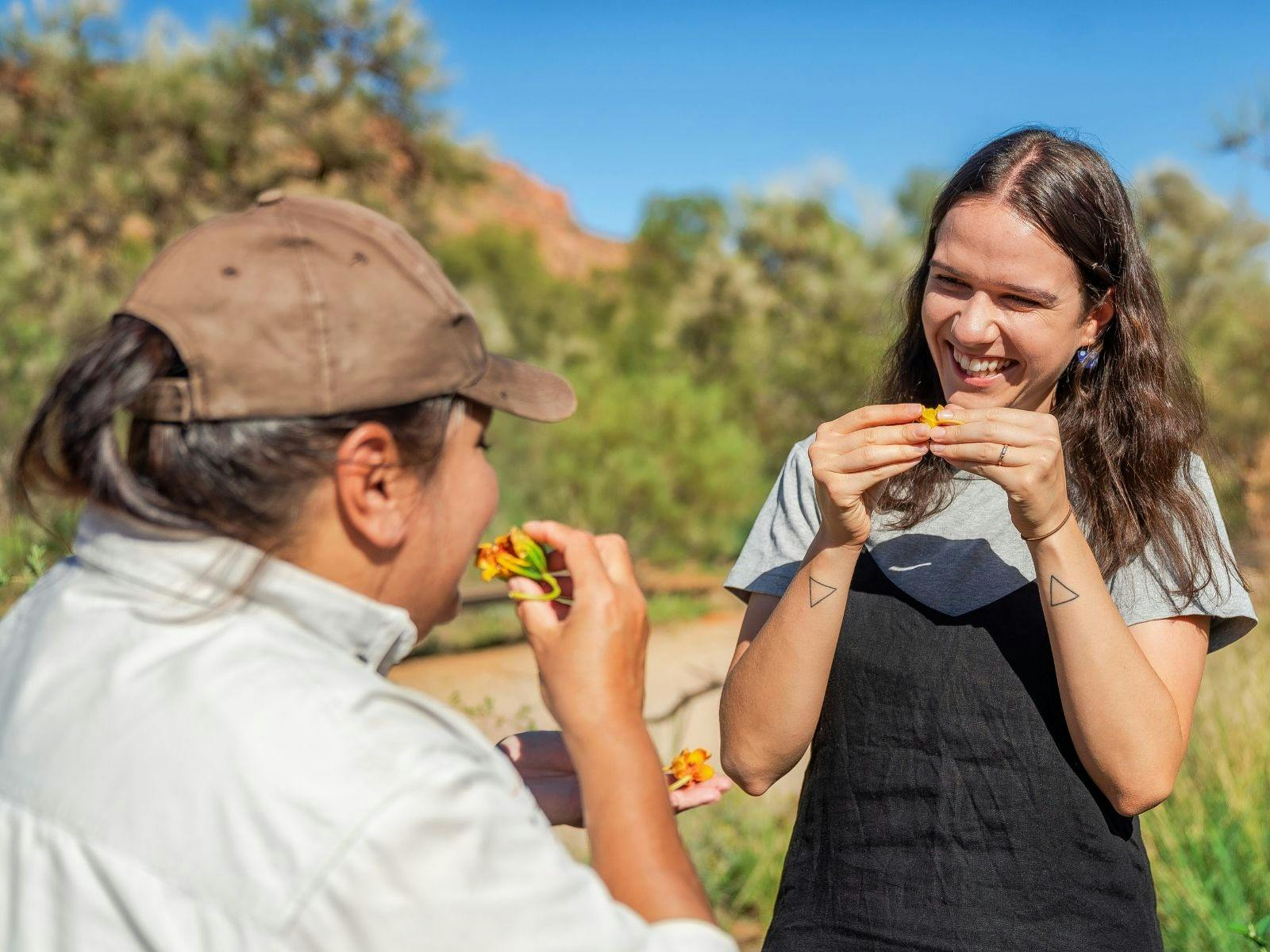 Desert Park guide sharing knowledge on bush foods with visitor