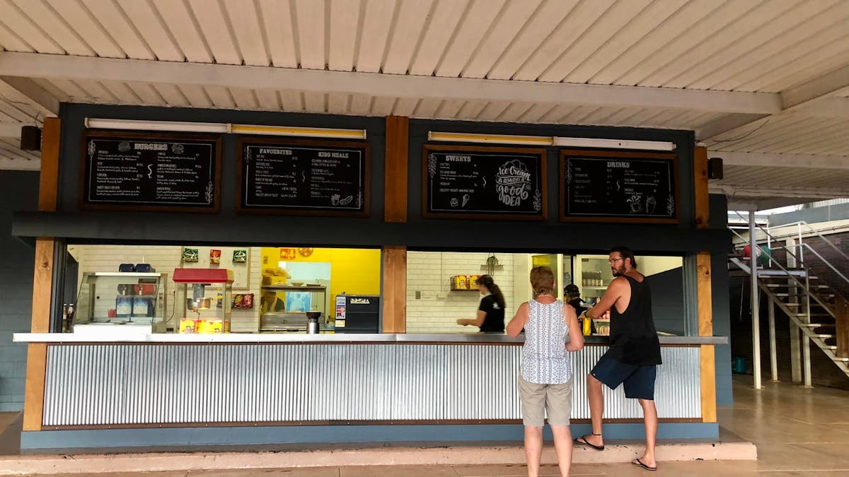 Customes being served delicious food at the Mareeba Drive In cafe