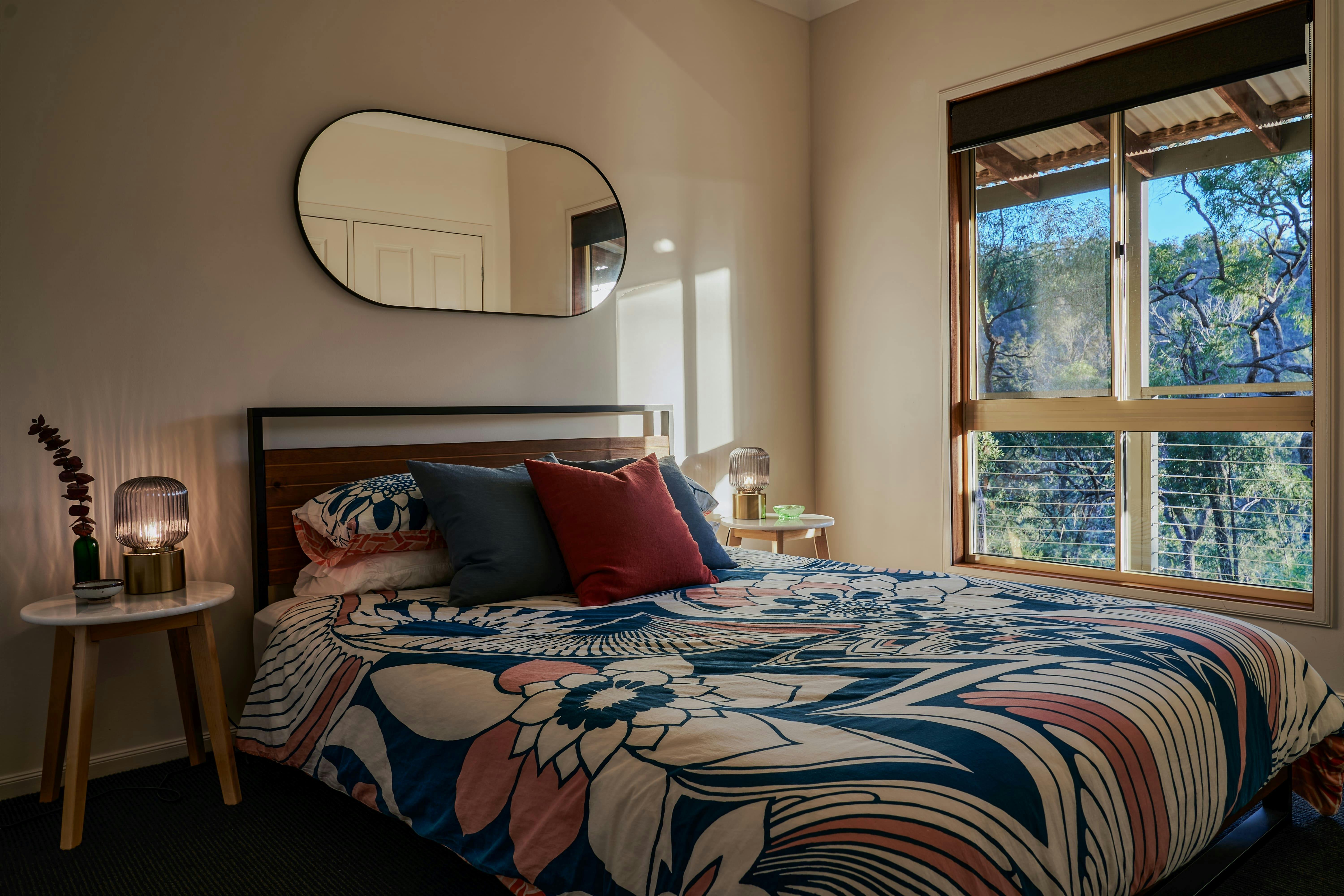 Queen sized bedroom with bushland views
