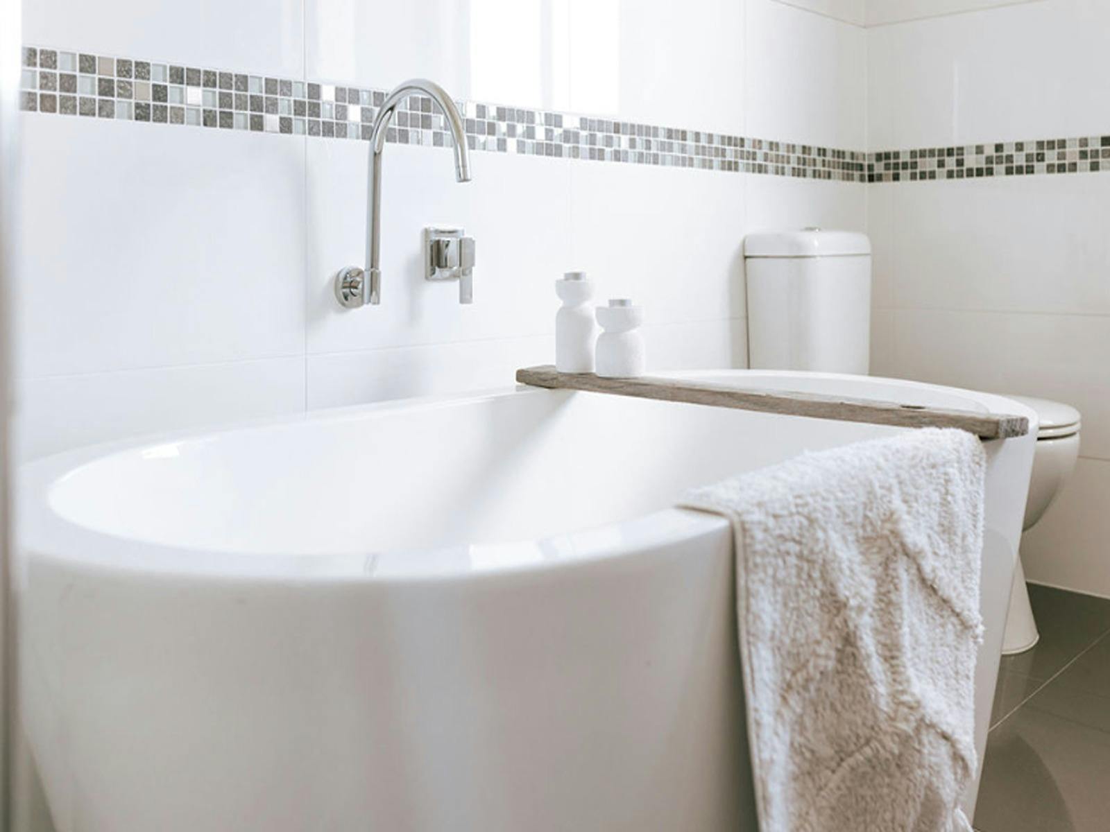 Bathroom with bath and shower