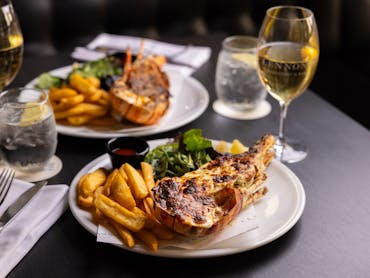 A lobster garlic butter and a lobster morney at a table at Lennons Restaurant & Bar - Brisbane City