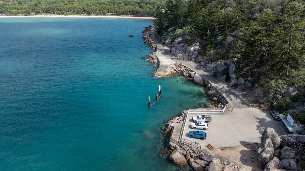 Aerial view of coastal car park and turquoise waters on Magnetic Island, Queensland