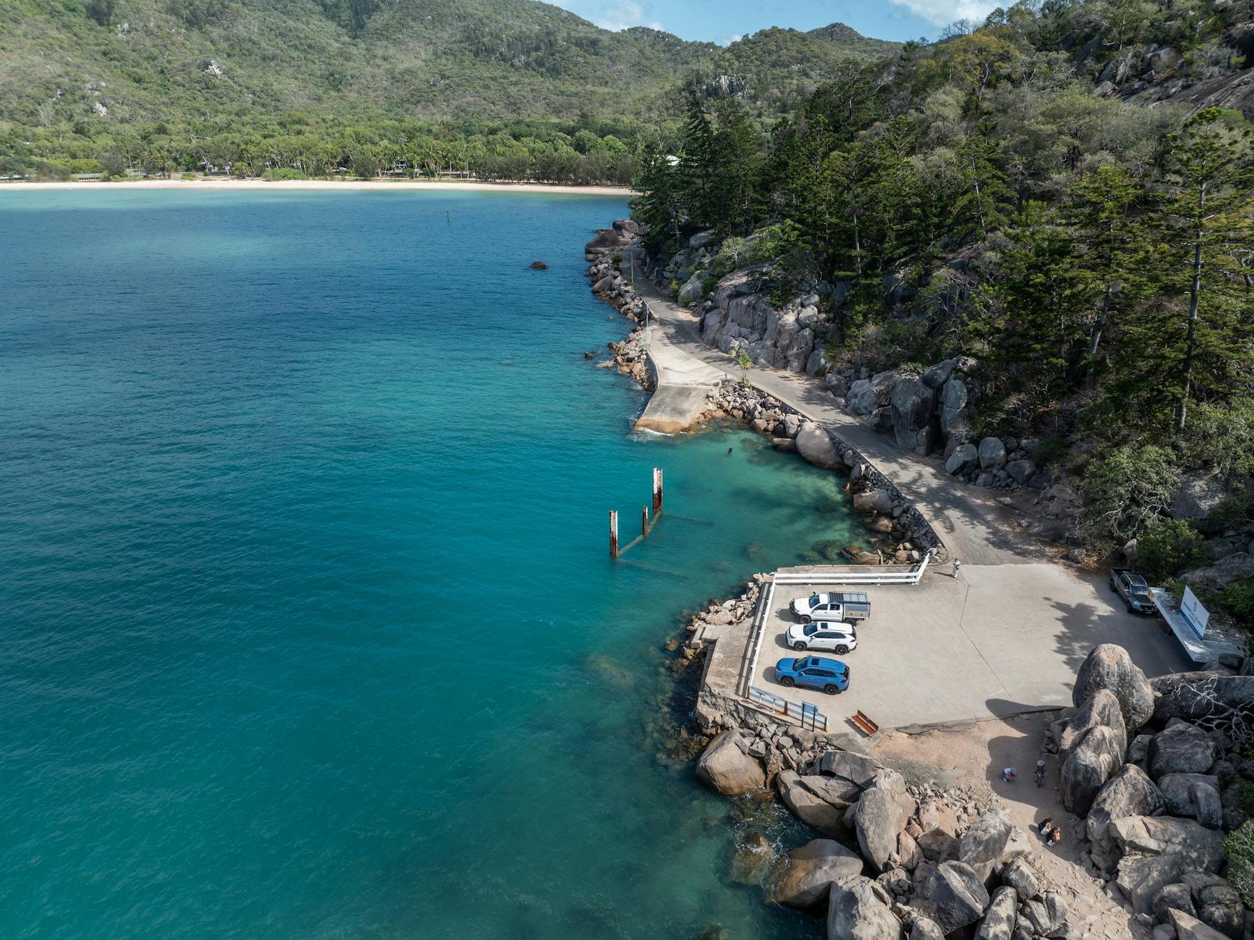 Aerial view of coastal car park and turquoise waters on Magnetic Island, Queensland