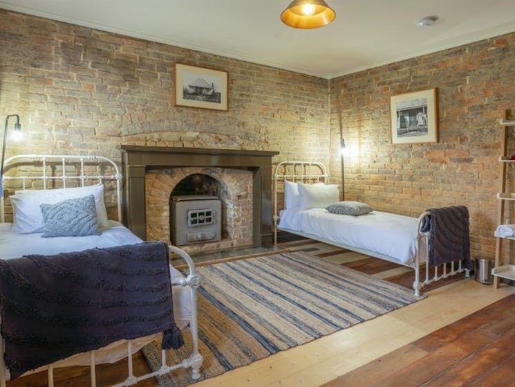 A bedroom with 2 single beds in Fairfax House in Hill End Historic Site. Photo: John Spencer &copy;