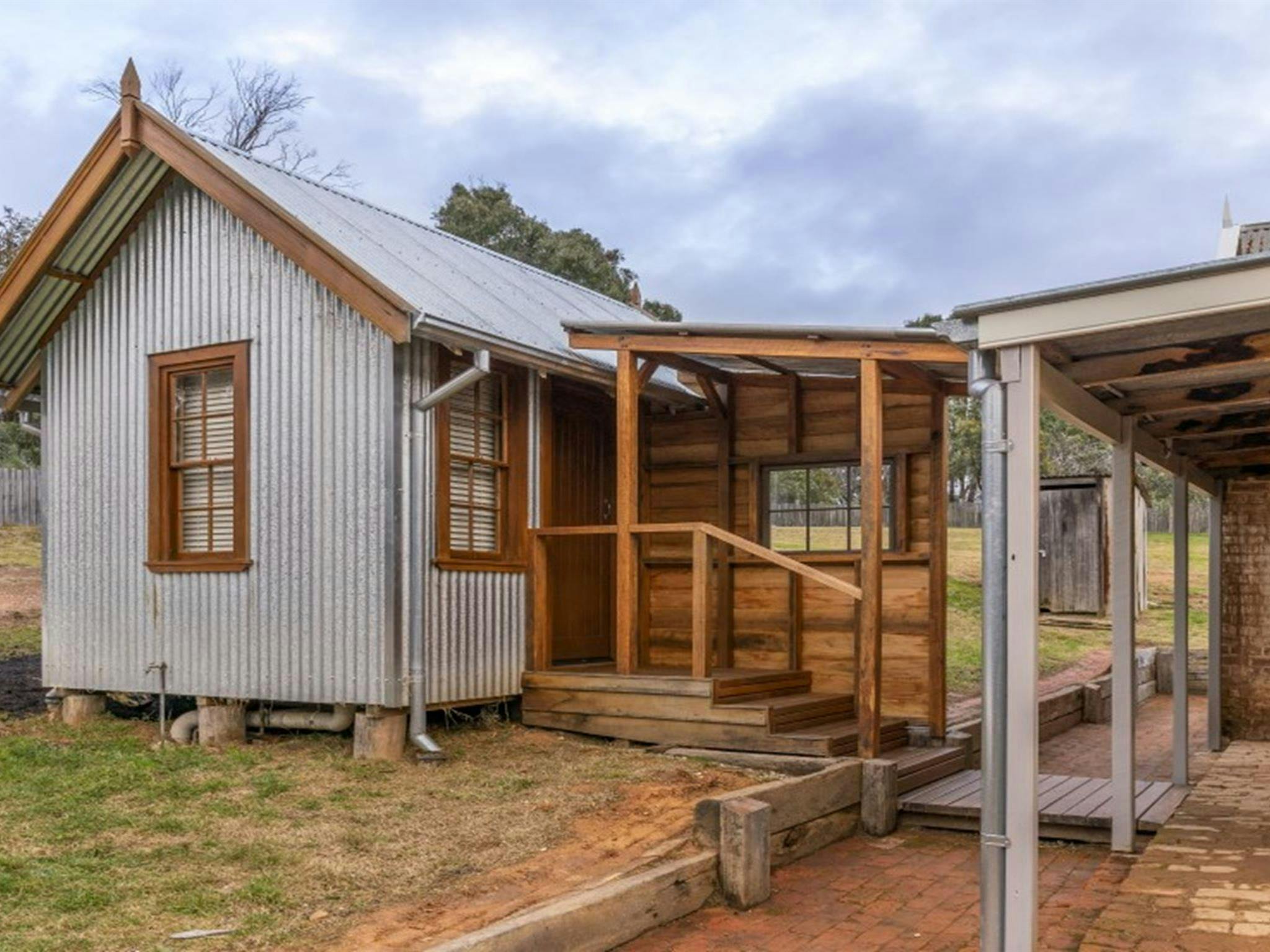 The undercover steps from the house to the external bathroom in Fairfax House, Hill End Historic