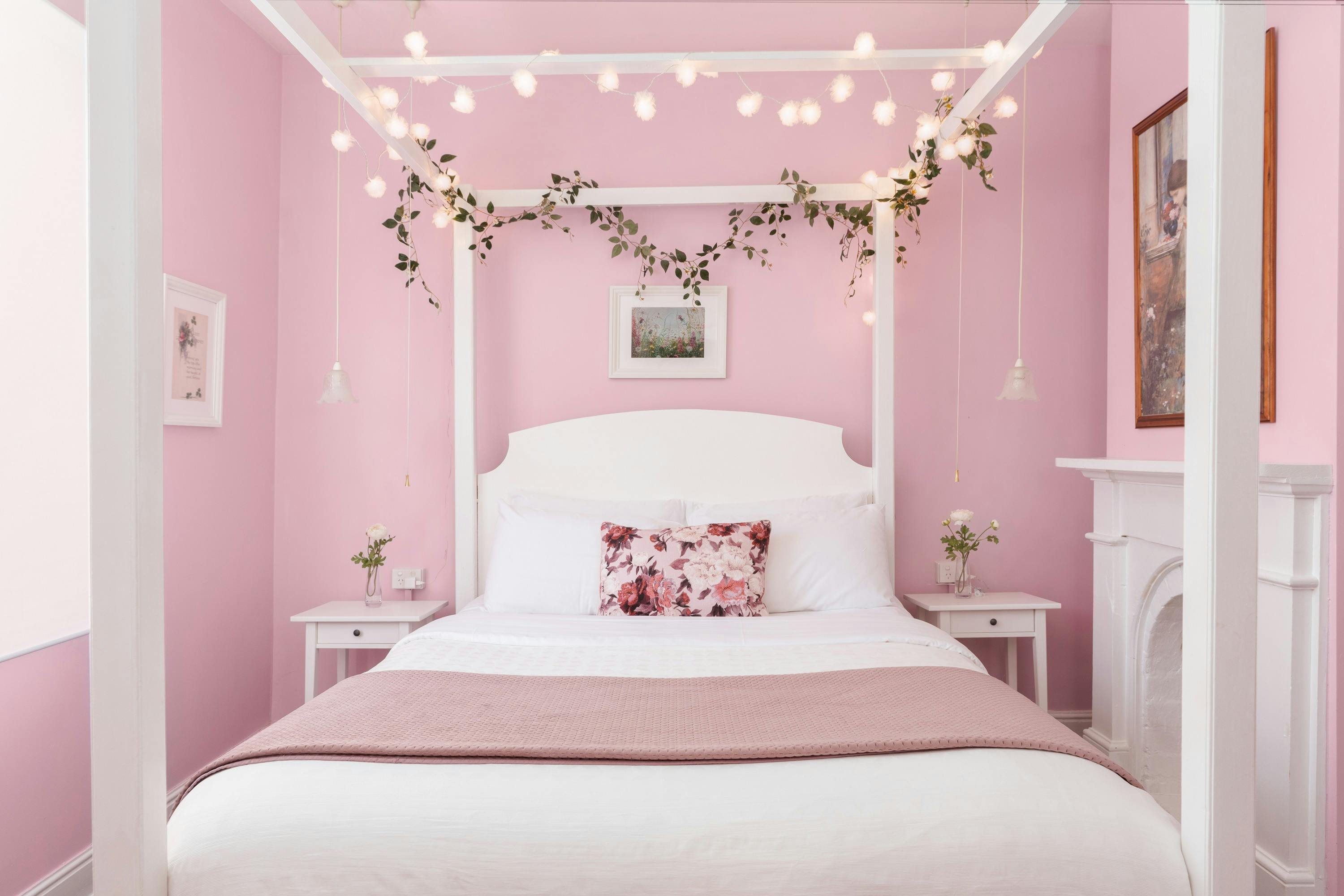 Four-poster bed adorned with fairylights