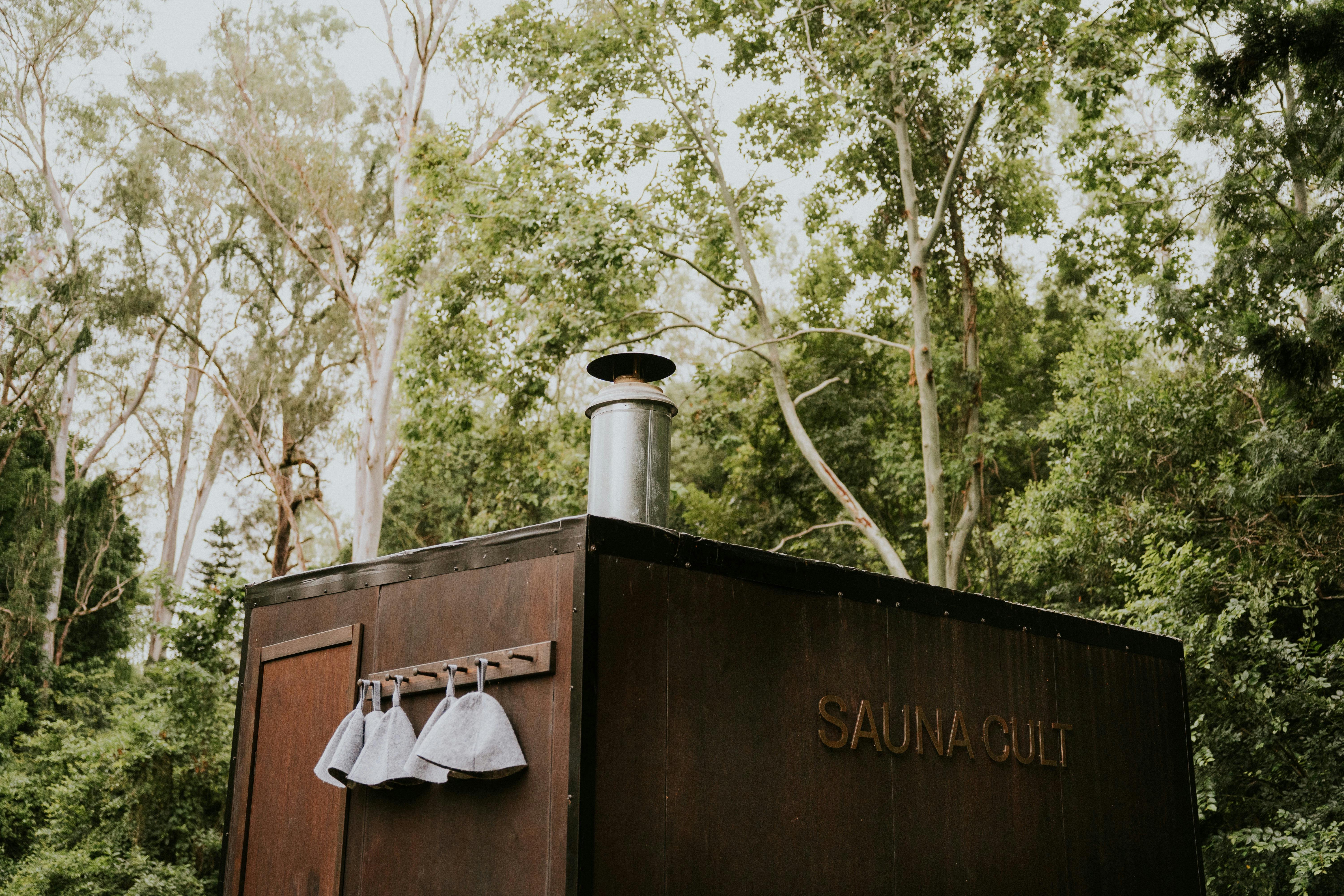 Sauna Cult Brisbane's portable sauna set up at a retreat, offering a tranquil and rejuvenating space