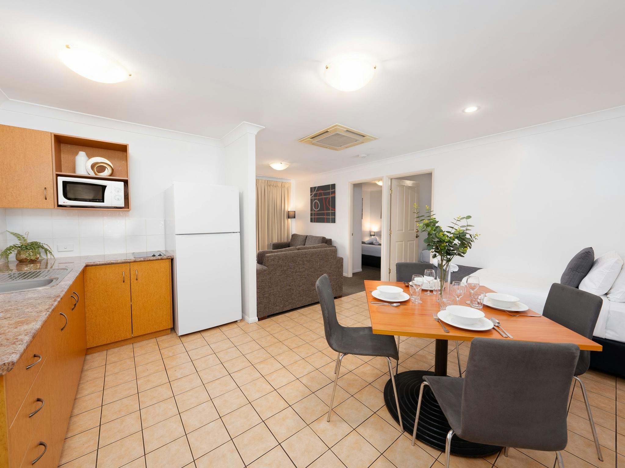 2 Bedroom Apartment open plan living with dining setting, kitchenette and lounge area 2 Bedroom Apartment open plan living with dining setting, kitchenette and lounge area
