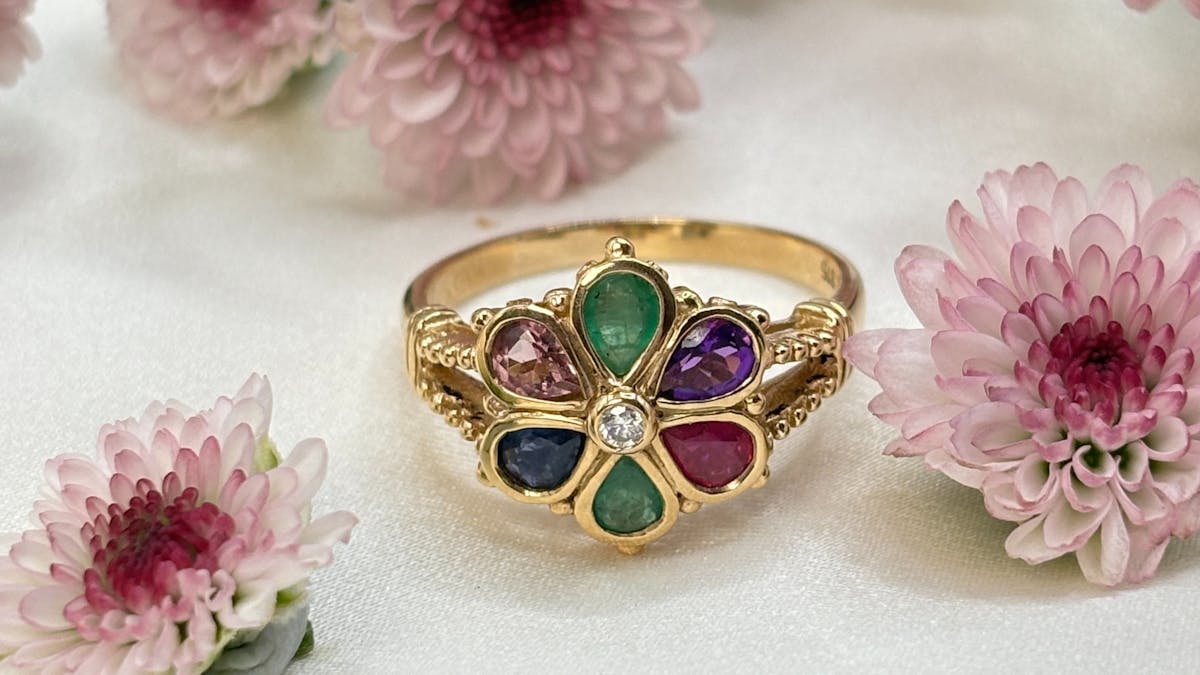 Flower ring with gemstones that come together to create the world dearest