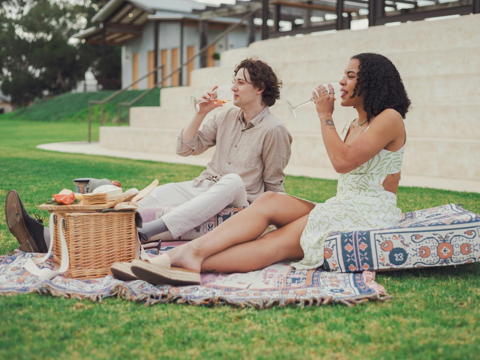 Two young adults enjoying a Picnic at Dandelion Vineyards, McLaren Vale