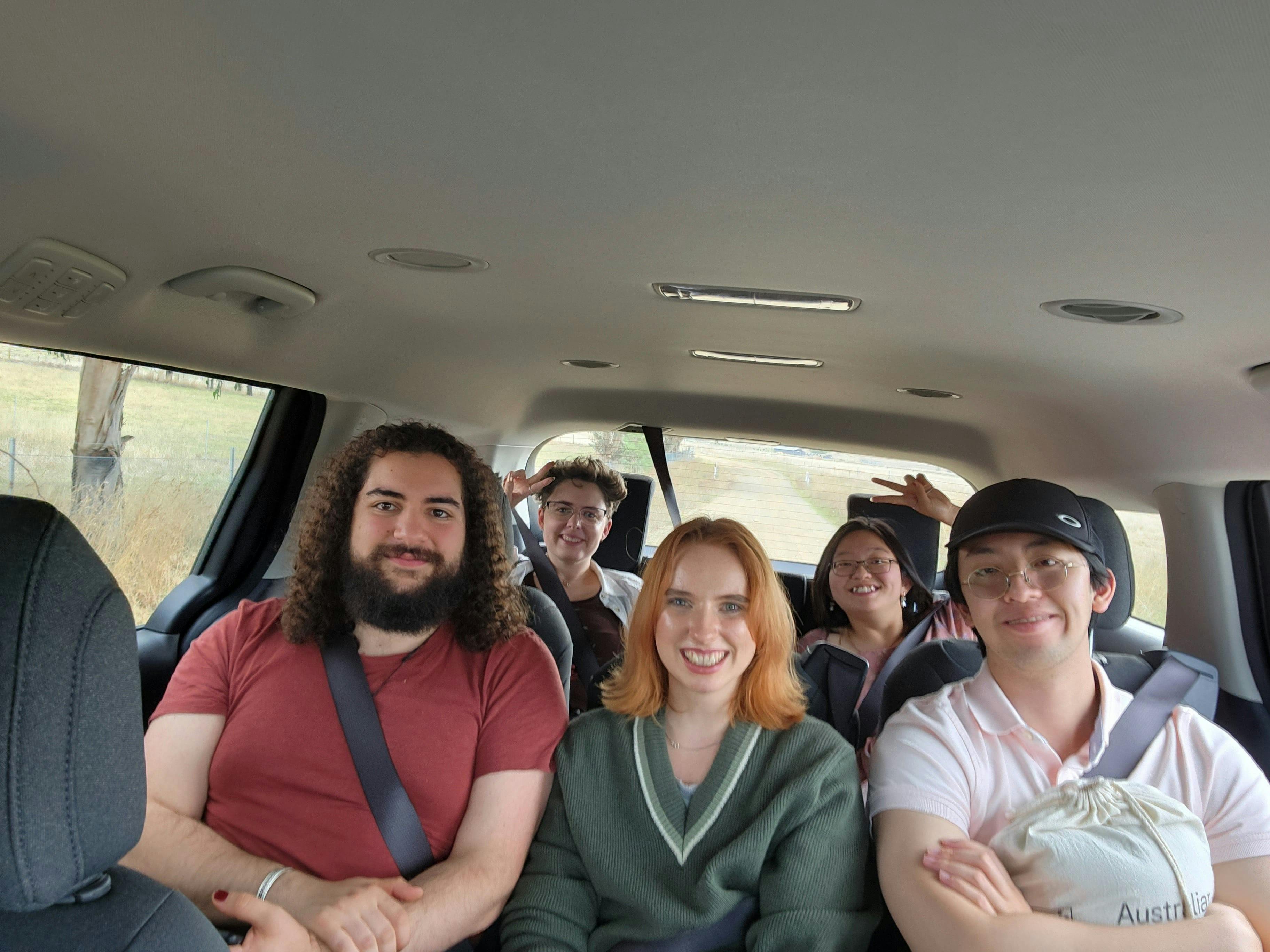 A group selfie in the vehicle