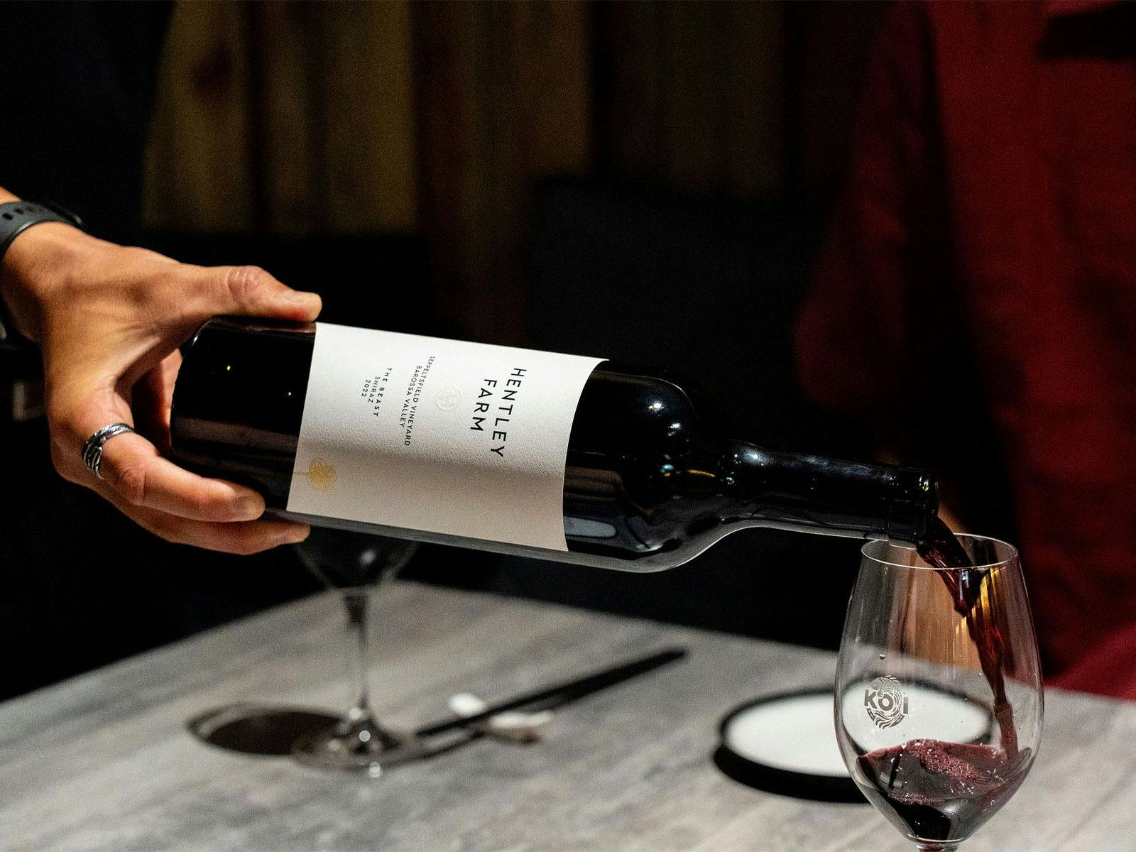 KOI BAr & Restaurant team member pouring a glass of Hently Farm The Beast wine.