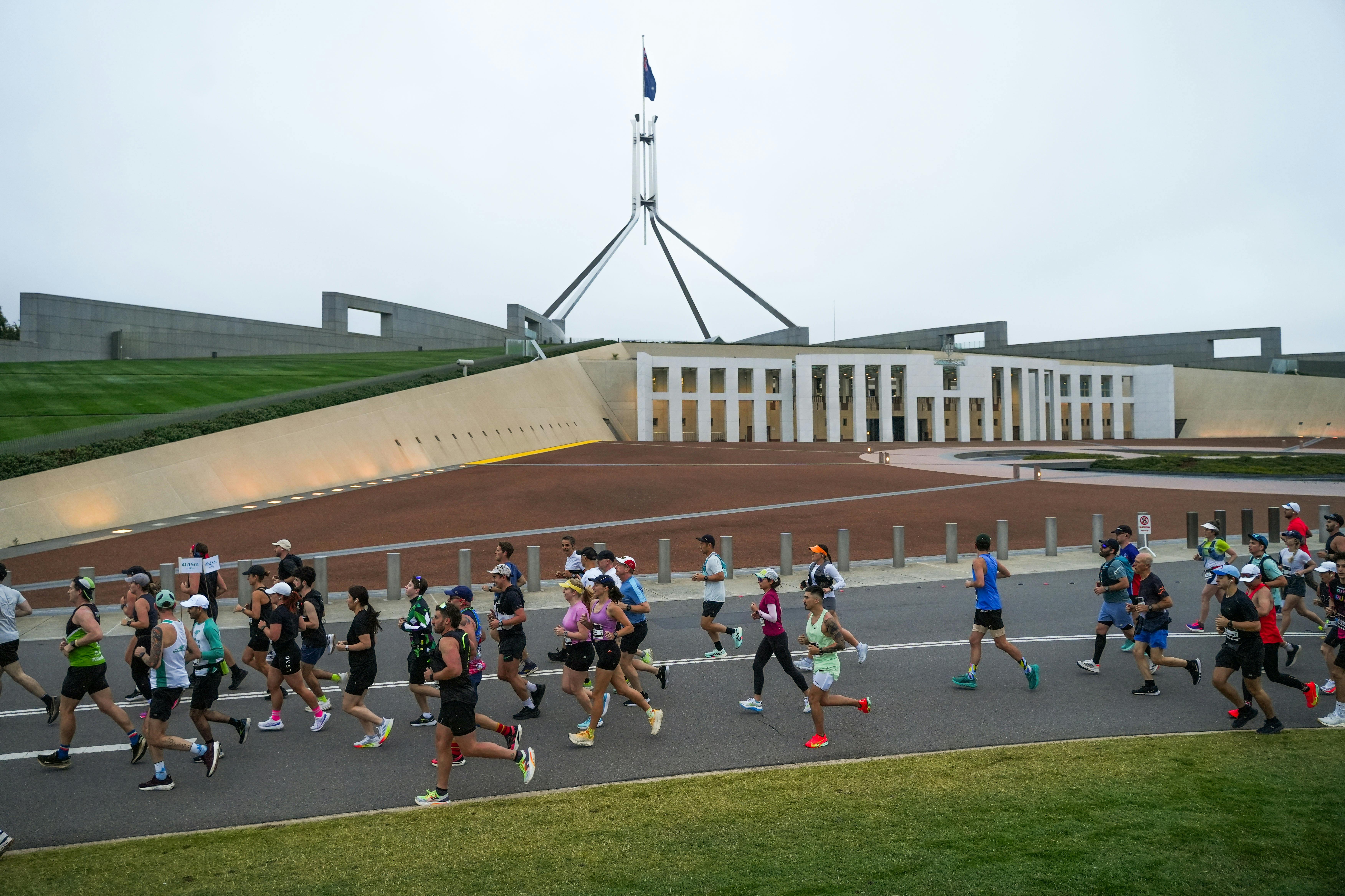 Participants running past New Parliament House