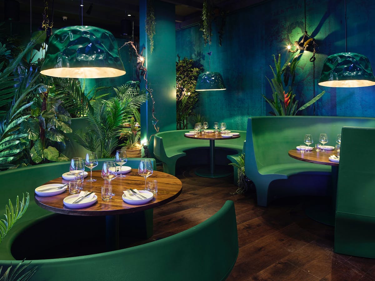 A closer view at the booth seating inside PingPong's hidden jungle oasis