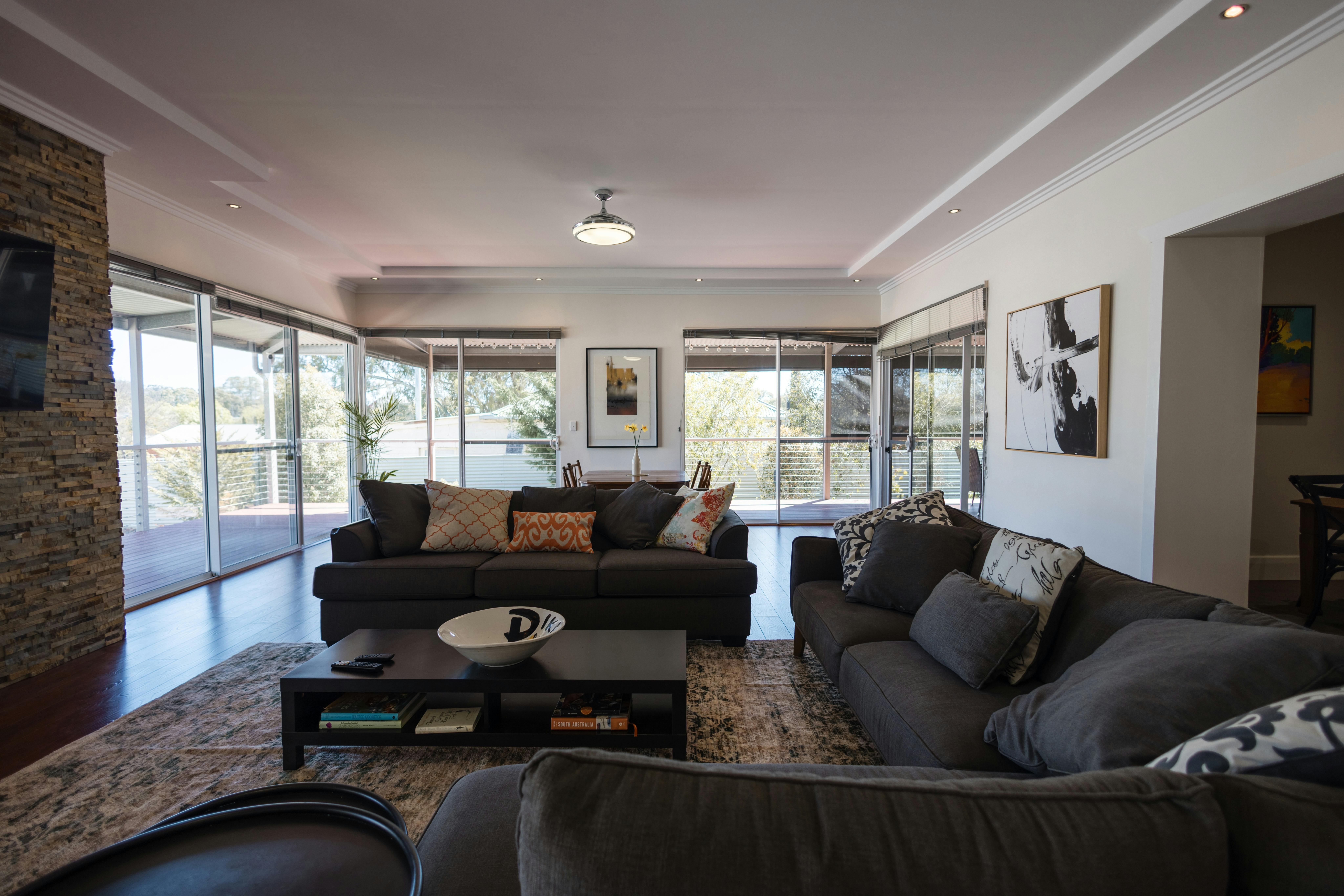 Large spacious living space extended from kitchen includes a smart TV