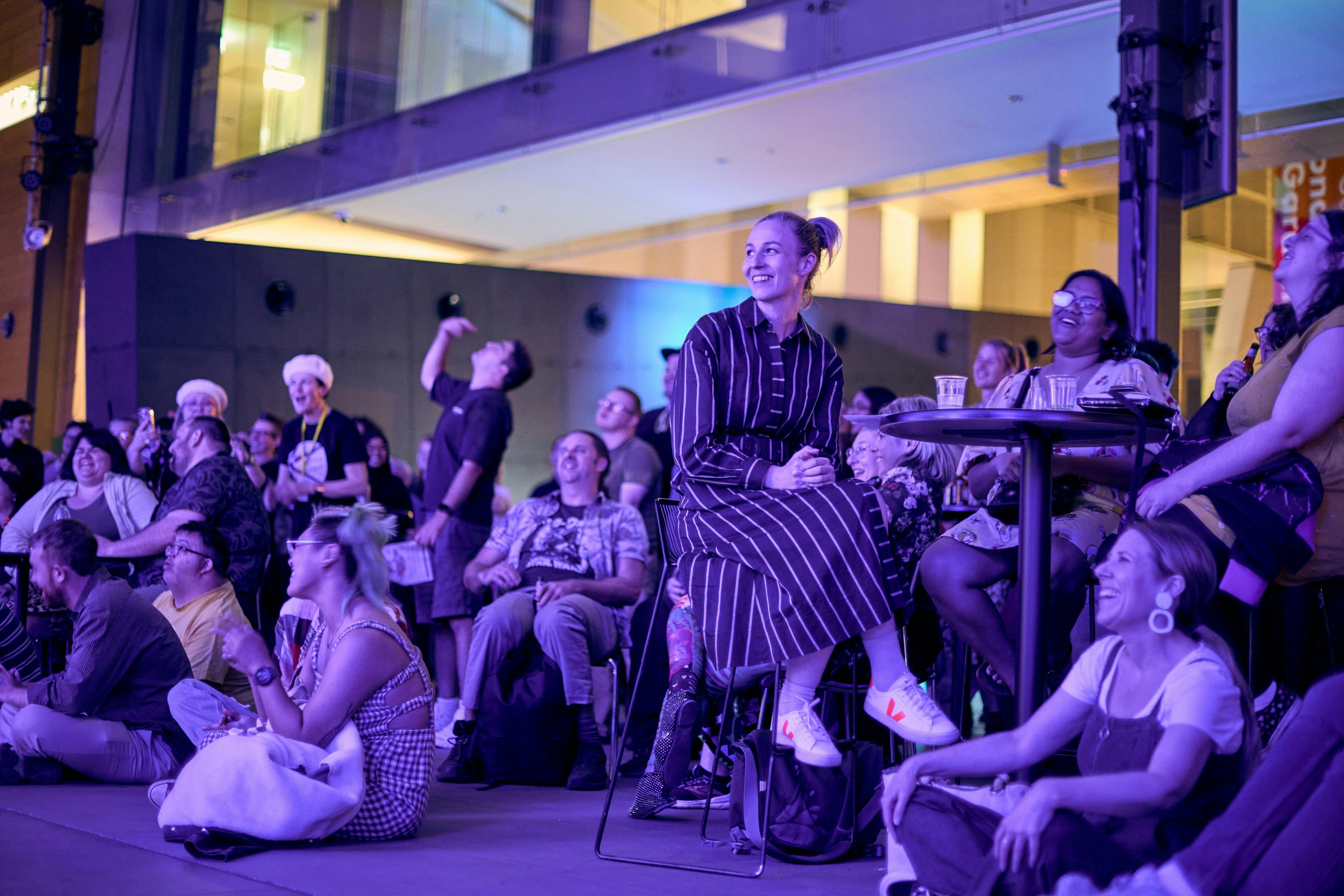 A large group of people seated and listening.