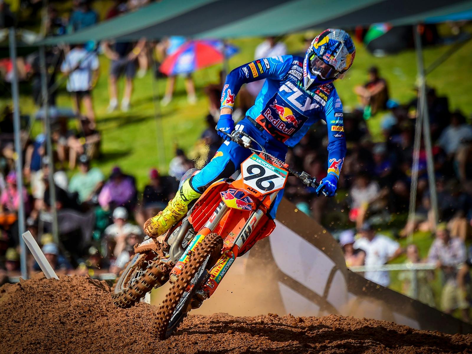 MXGP rider on bike on track with crowd in background