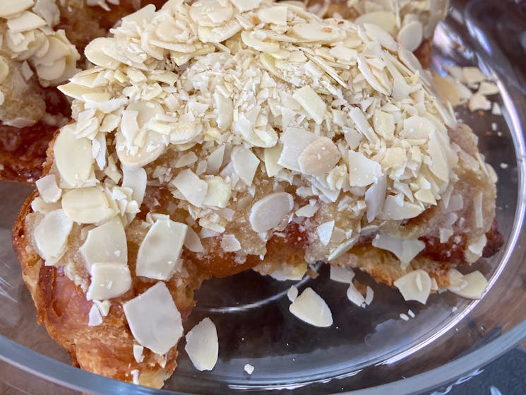 Almond Croissants are filled and coated with an almond cream and topped with crunchy almond flakes.