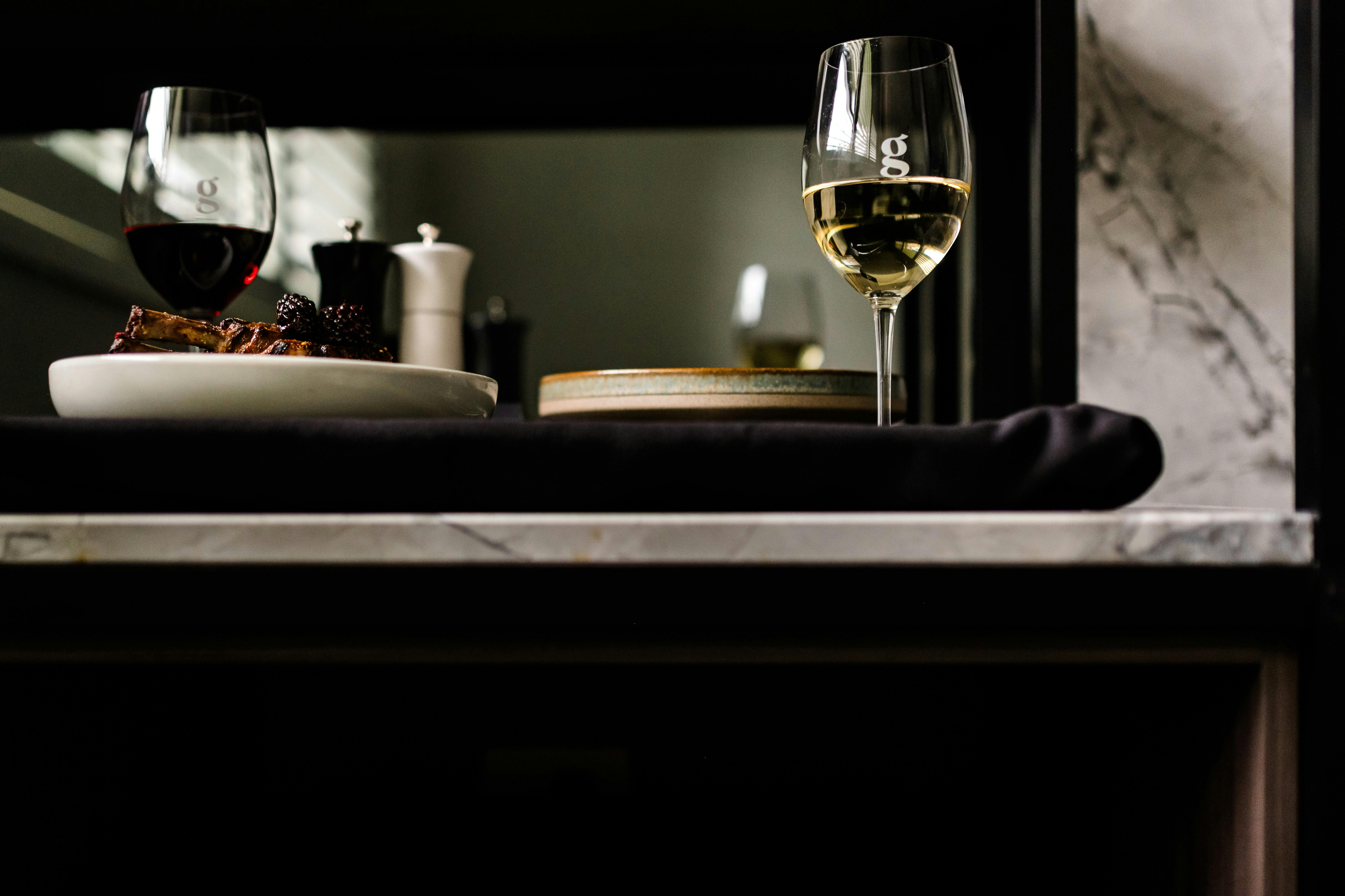 Room service tray with wines, beautifully presented main courses delivered to accessible suite