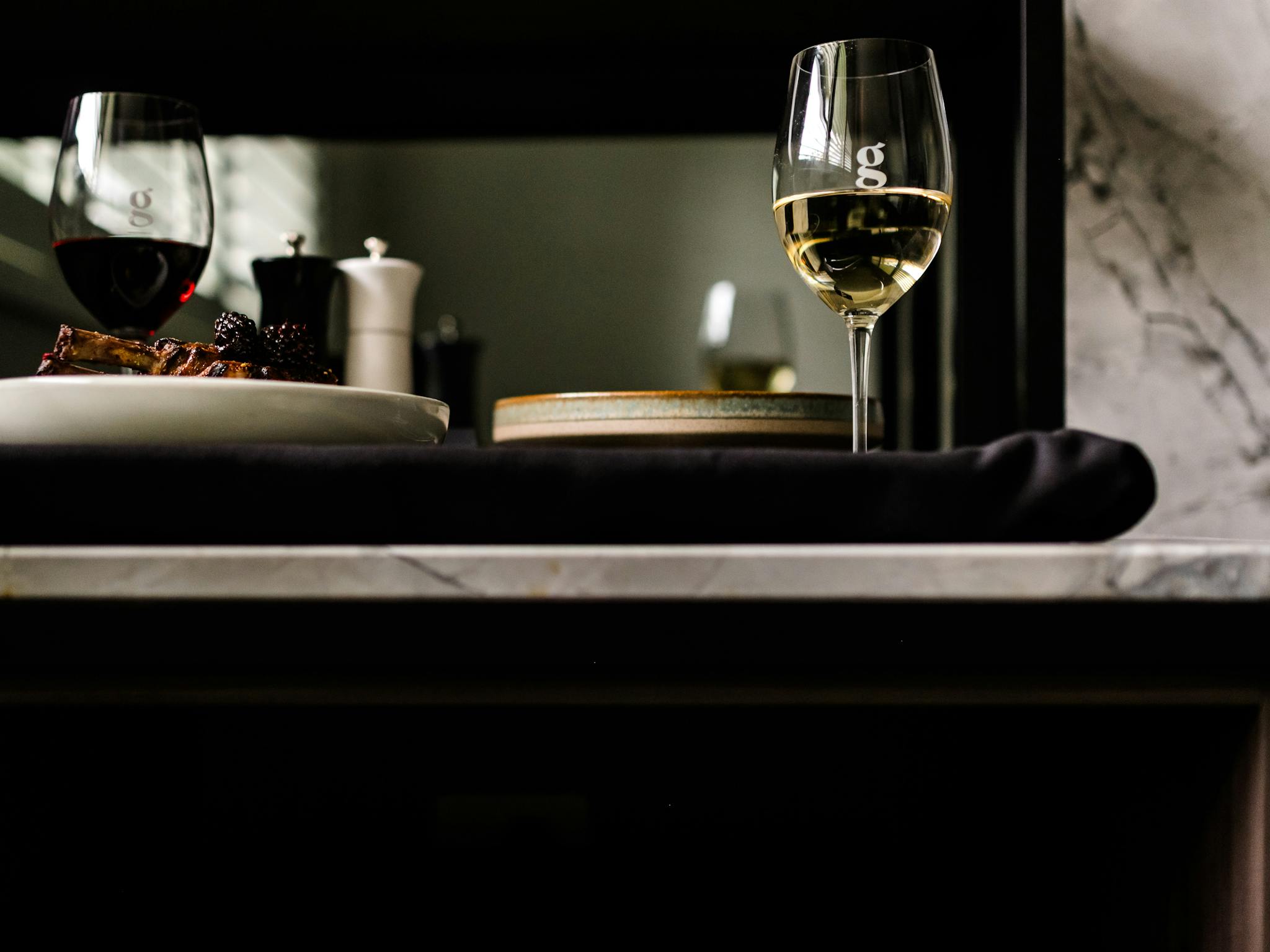 Room service tray with wines, beautifully presented main courses delivered to accessible suite