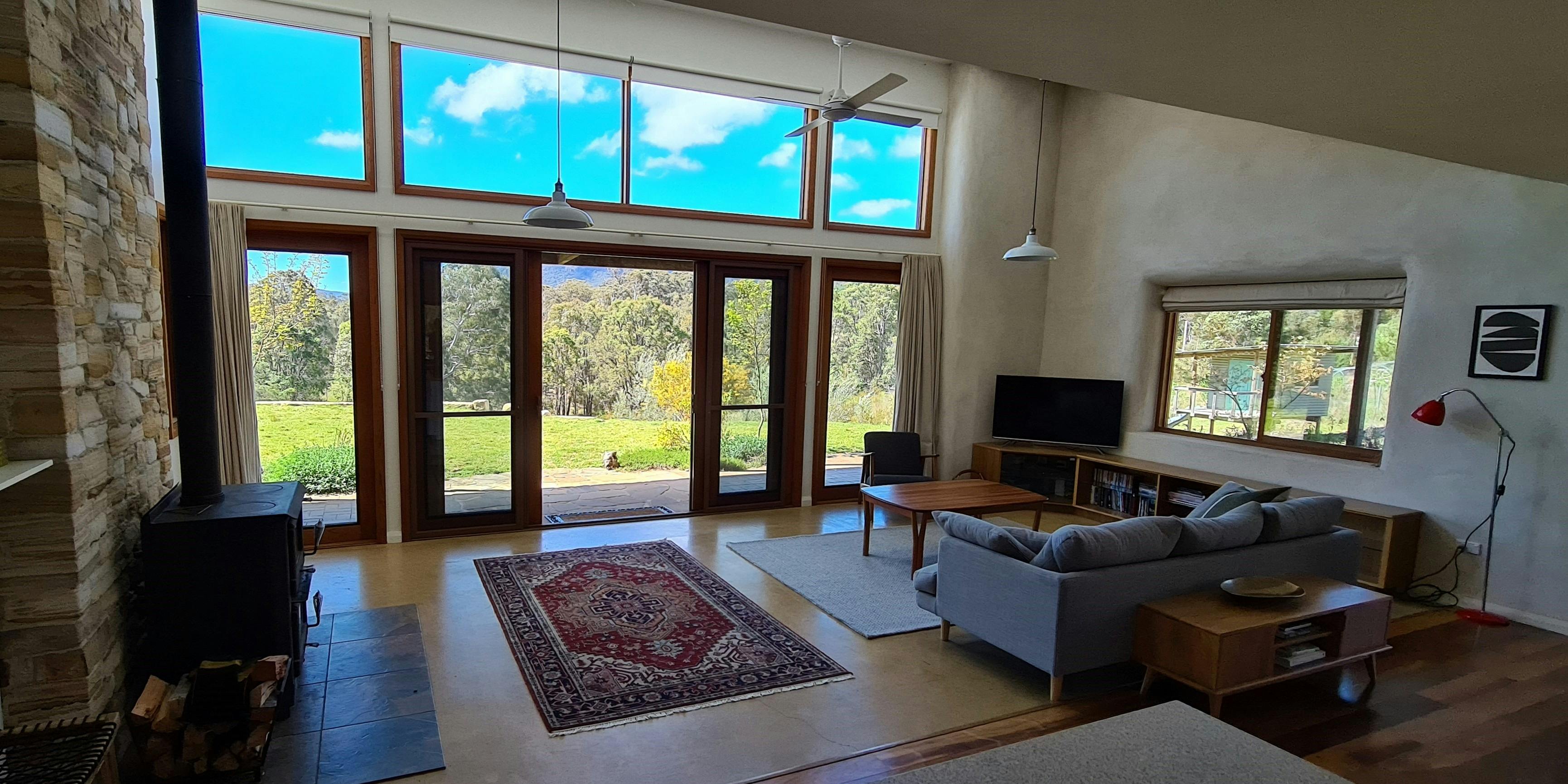 Open plan living area encased in strawbale walls. Cool in summer cosy in winter