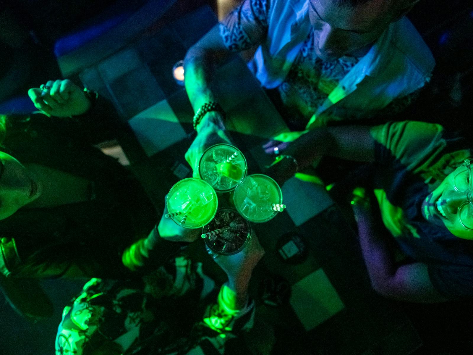 Friends enjoying drinks at Universal Sydney nightclub in Darlinghurst, Sydney