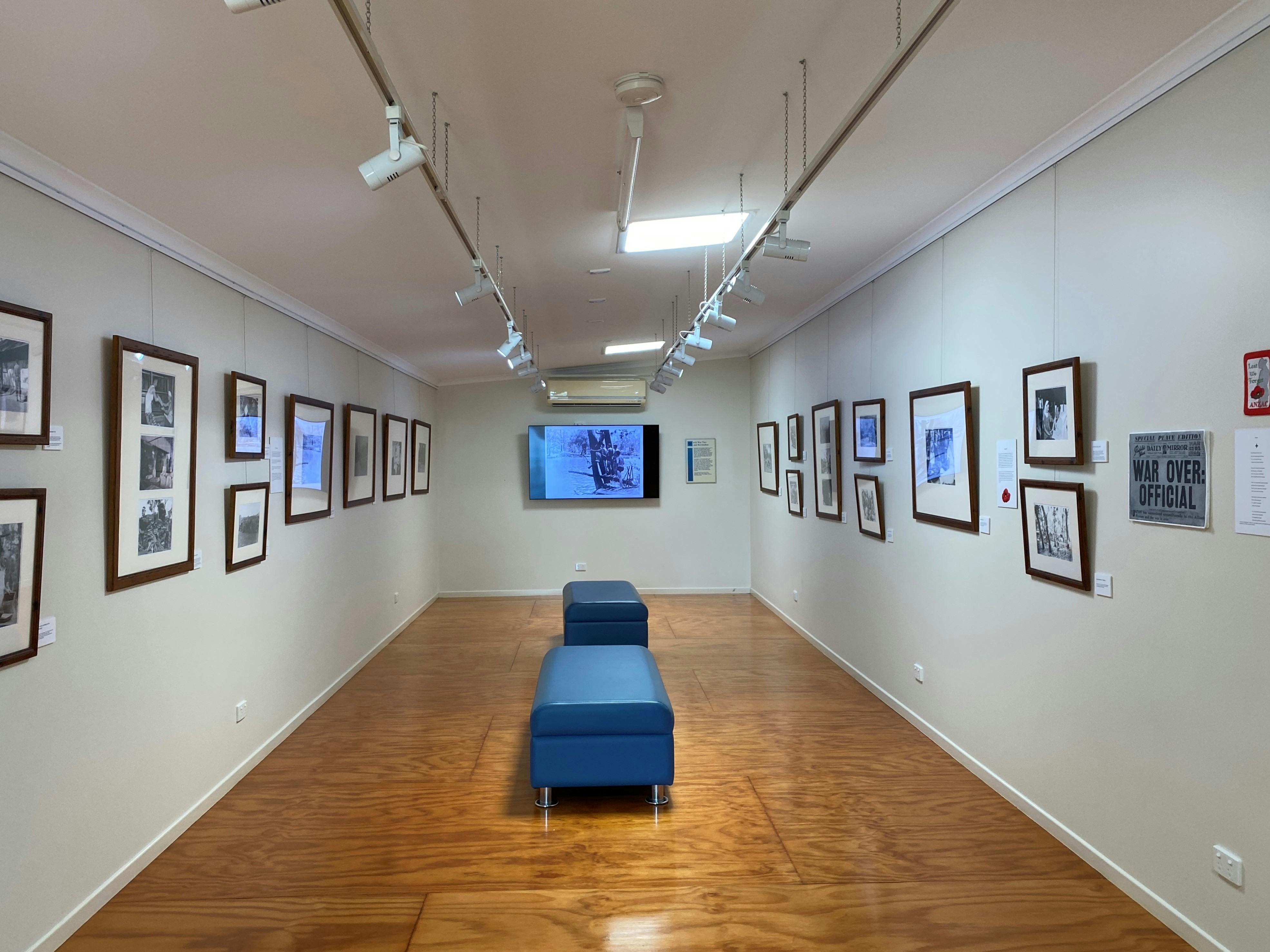 Gallery with  framed photos on the walls