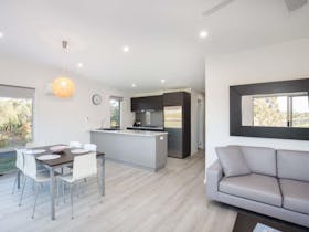 Kitchen, dining and lounge area of a Lakeside Villa