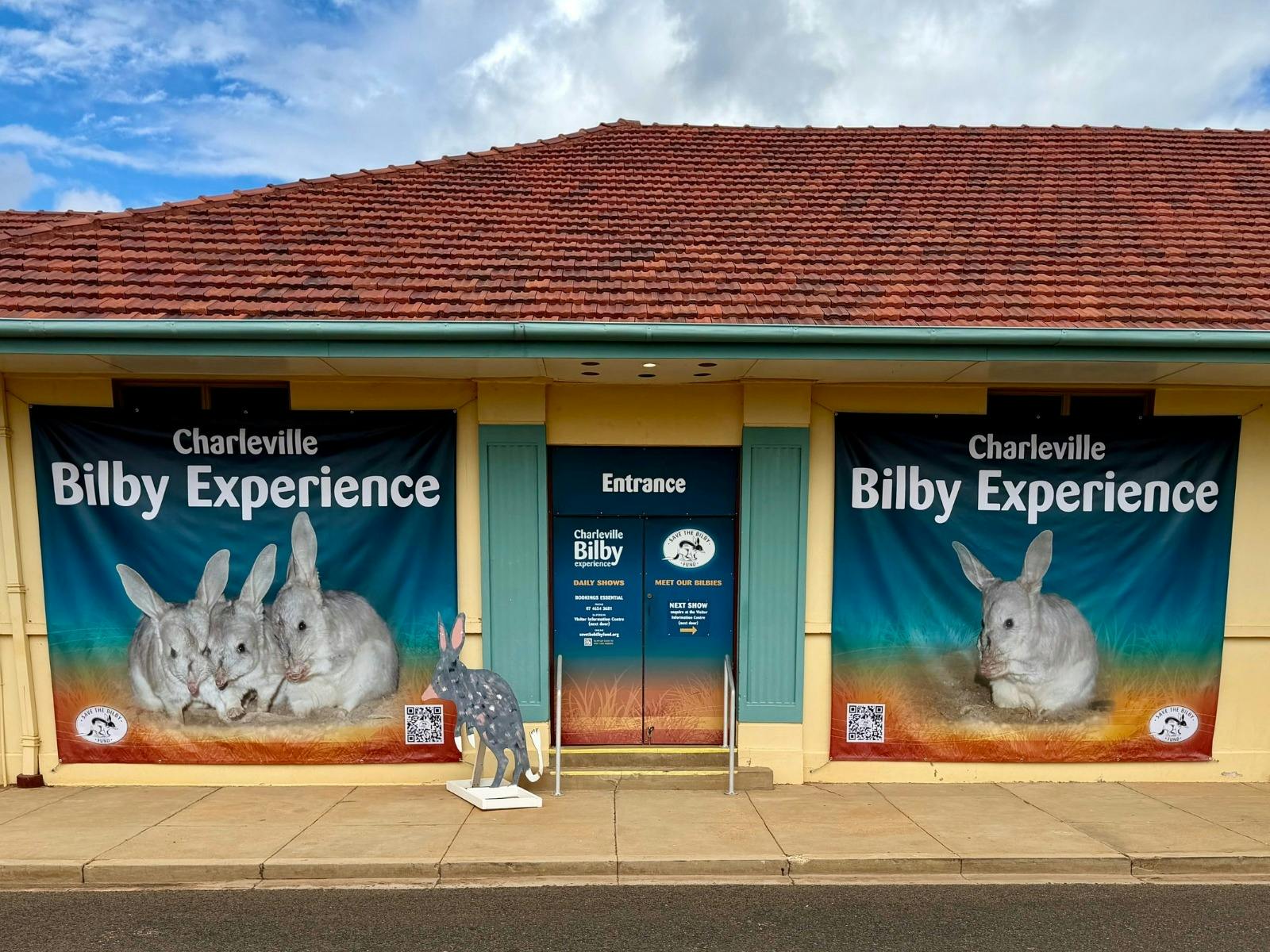 Exterior of the Charleville Bilby Experience building featuring large bilby banners & entrance sign.