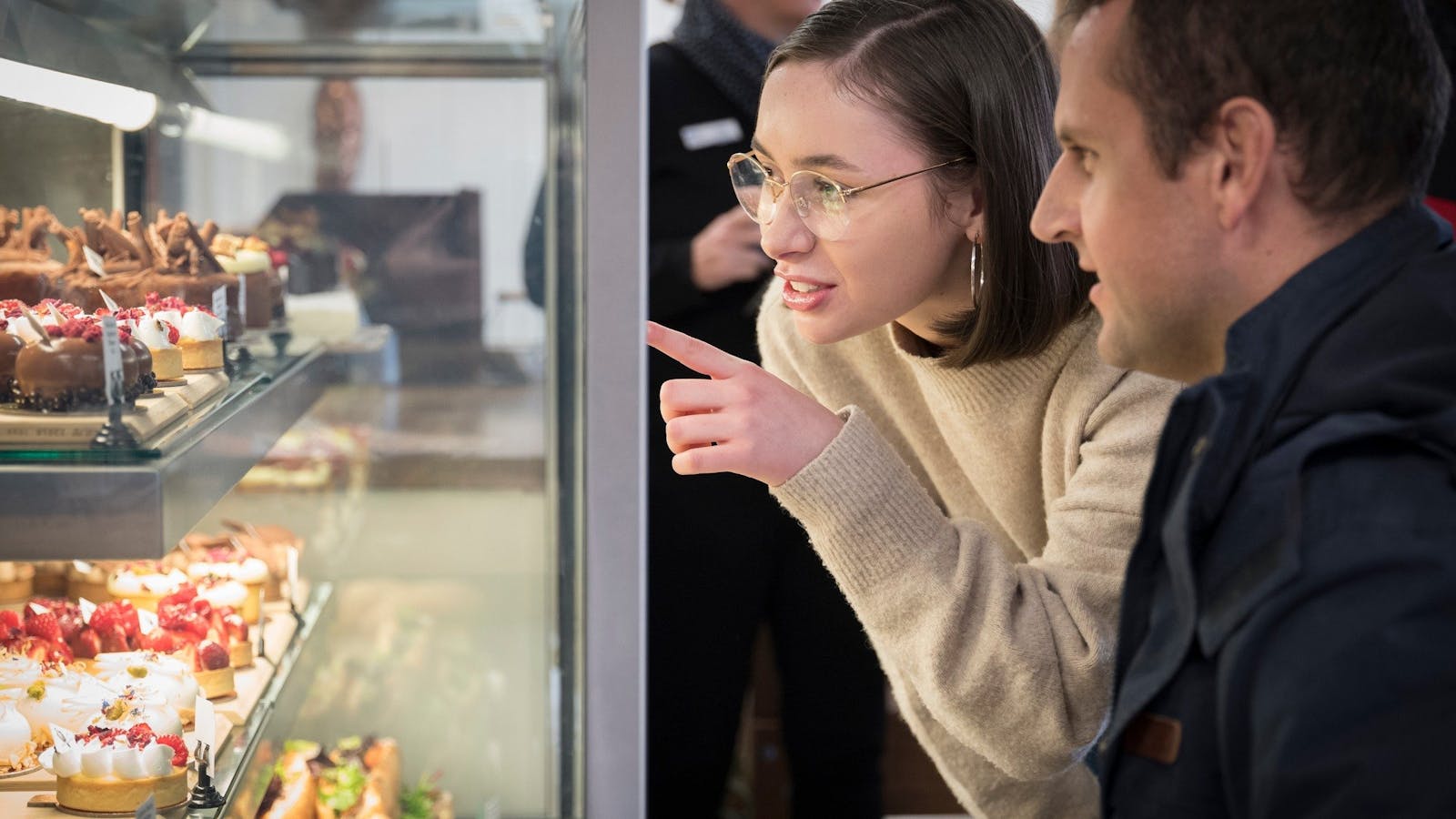 Trying to decide on what treat to choose at The Icky Sticky Patisserie